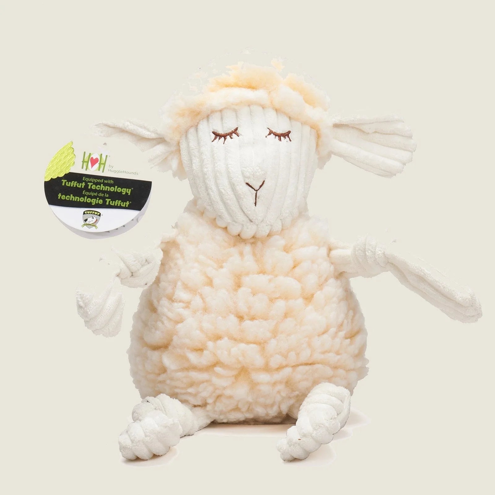 Soft cream plush lamb dog toy with knotted limbs and embroidered features, made from HuggleFleece® fabric.