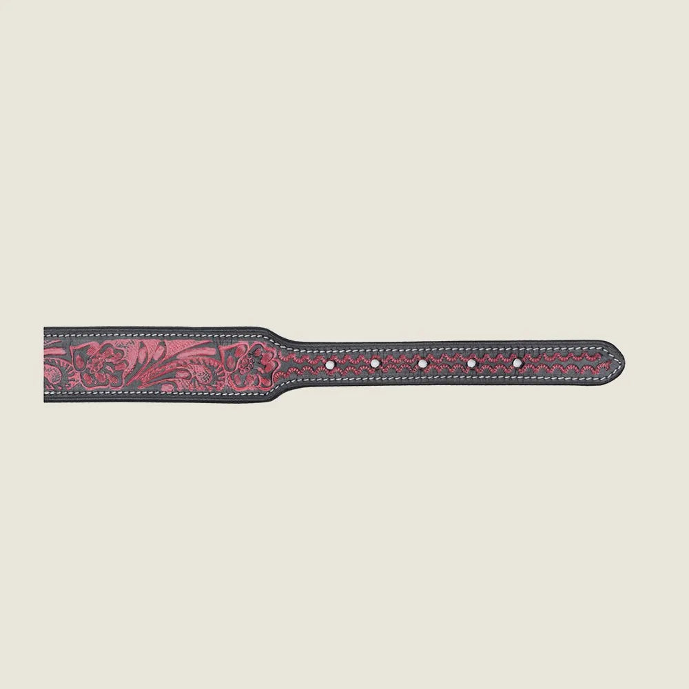 Hand-tooled leather dog collar in rich red with floral patterns and contrasting black edges, showcasing craftsmanship.