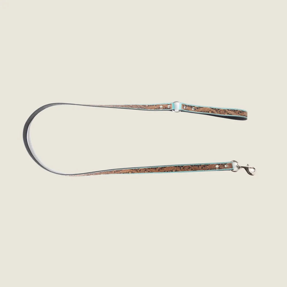 Turquoise leather dog leash with floral embossing and silver hardware, showcasing Southwestern style for daily walks.
