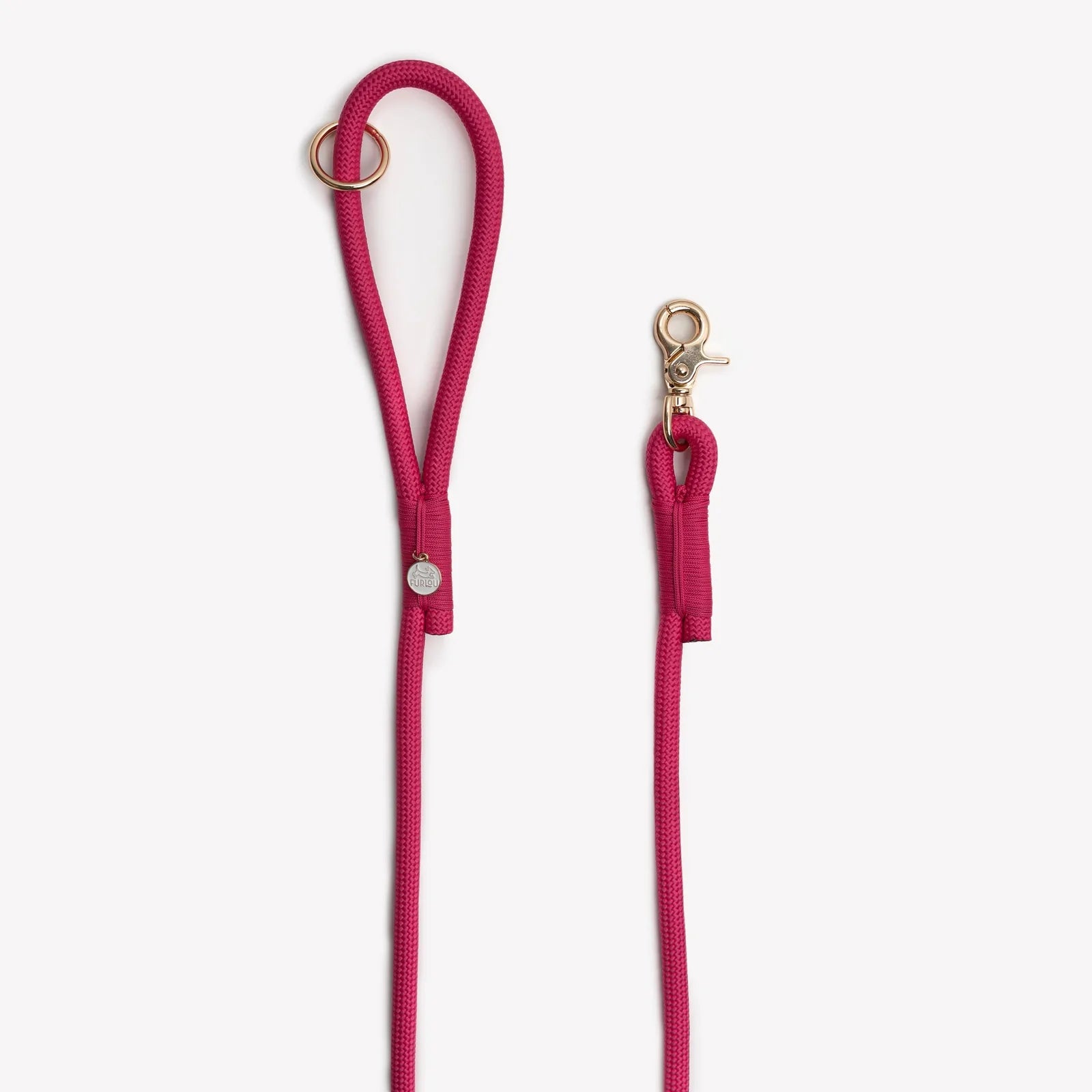 Magenta braided rope leash with an O-ring handle and gold clip, designed for dog walking and everyday use.