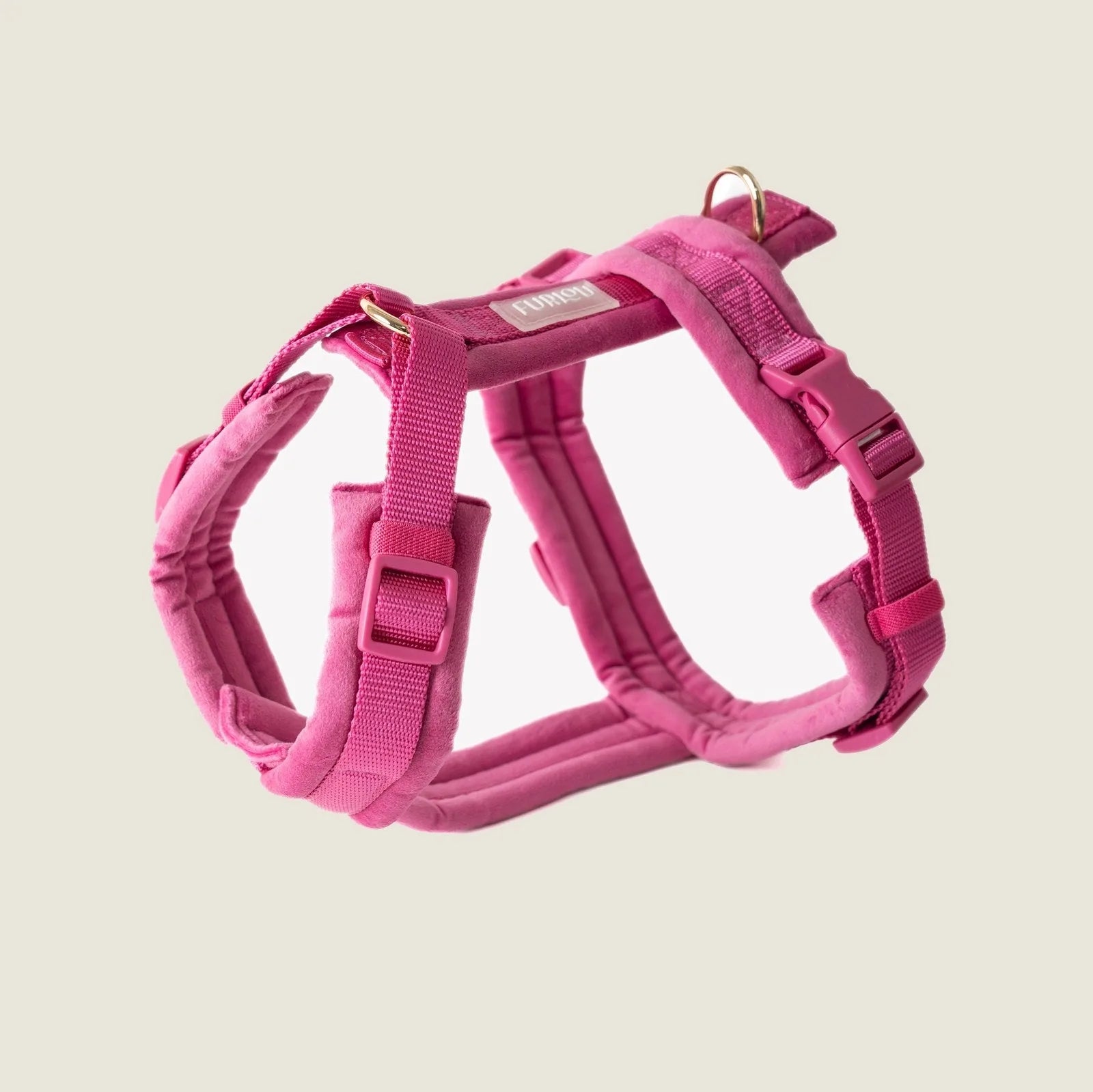 Magenta velvet dog harness with adjustable straps and gold hardware for stylish walks.