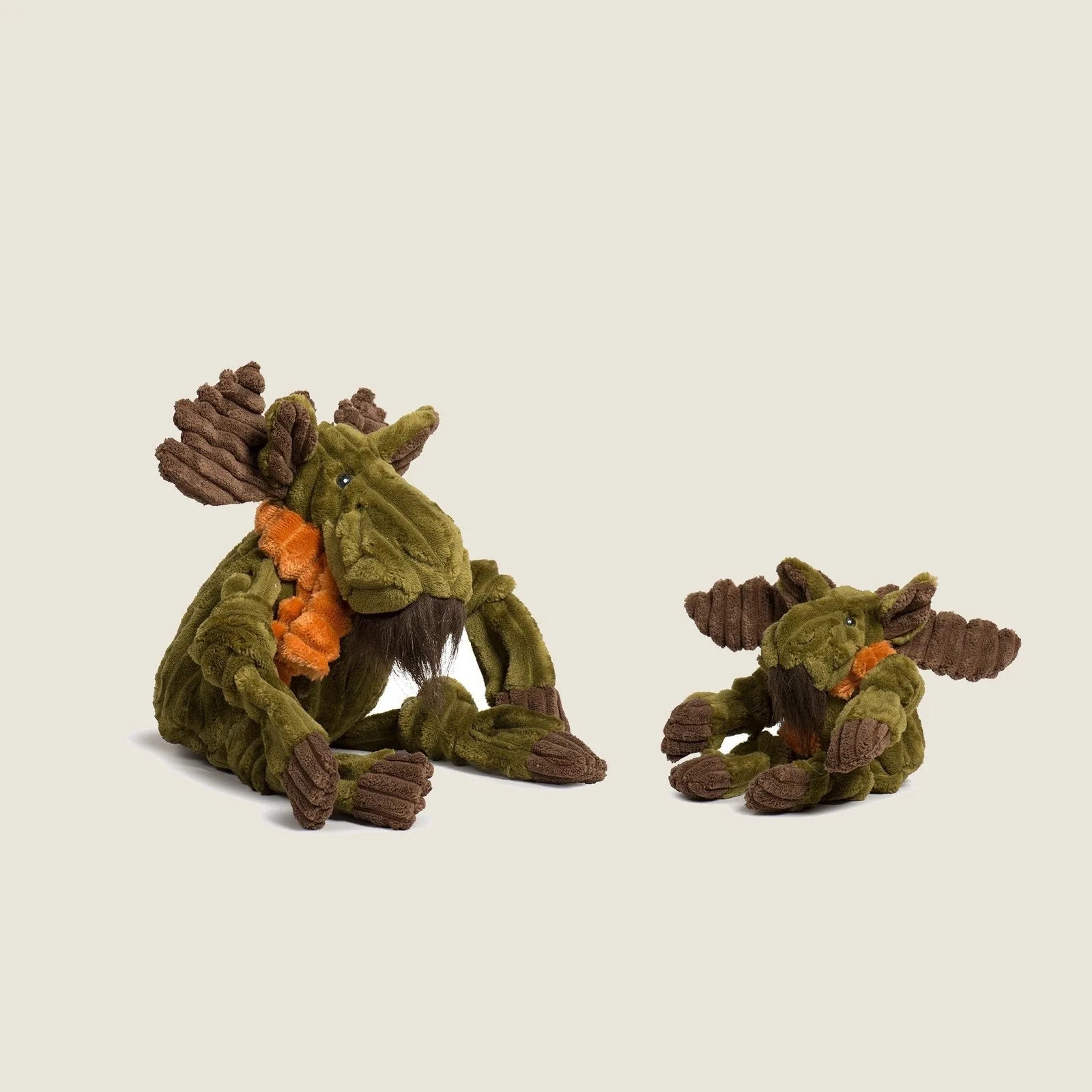 Cuddly Milo Moose plush dog toys in green with brown accents, featuring knotted limbs for playful interaction.