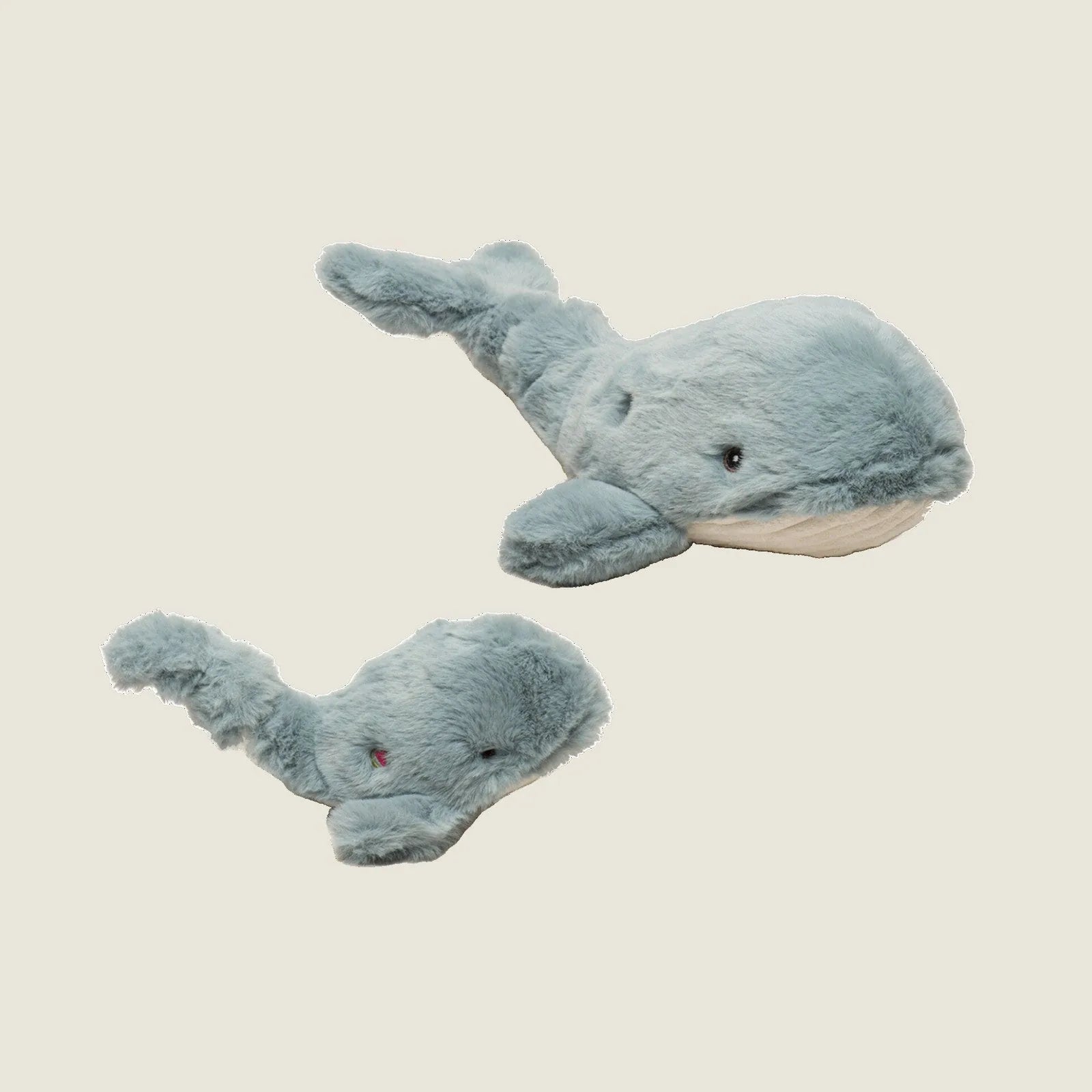Soft plush Mobie Whale dog toys in light blue, featuring unique knotted designs, sized small and large for playful pups.