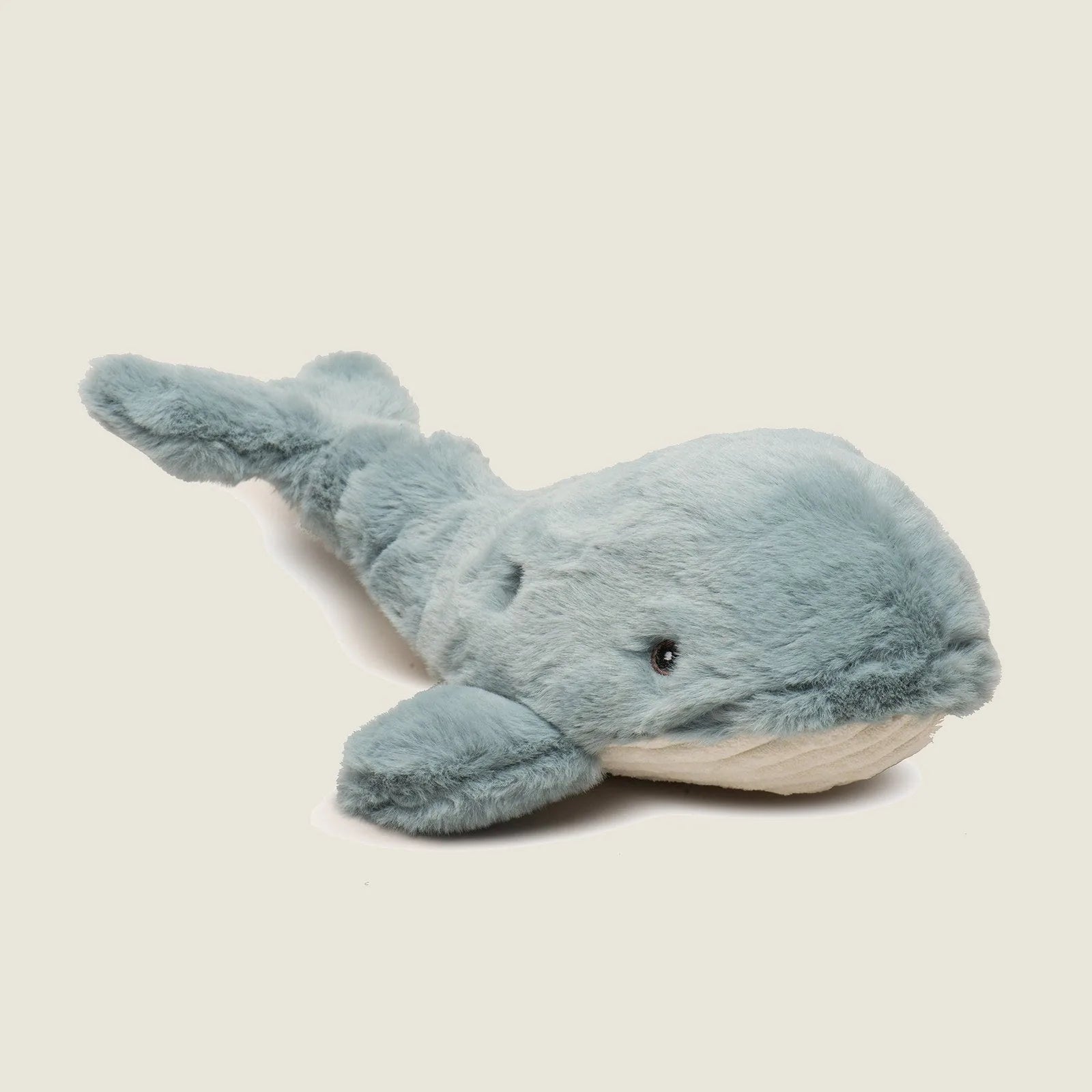 Soft, plush whale-shaped dog toy in light blue with a knotted design and two squeakers for interactive play.