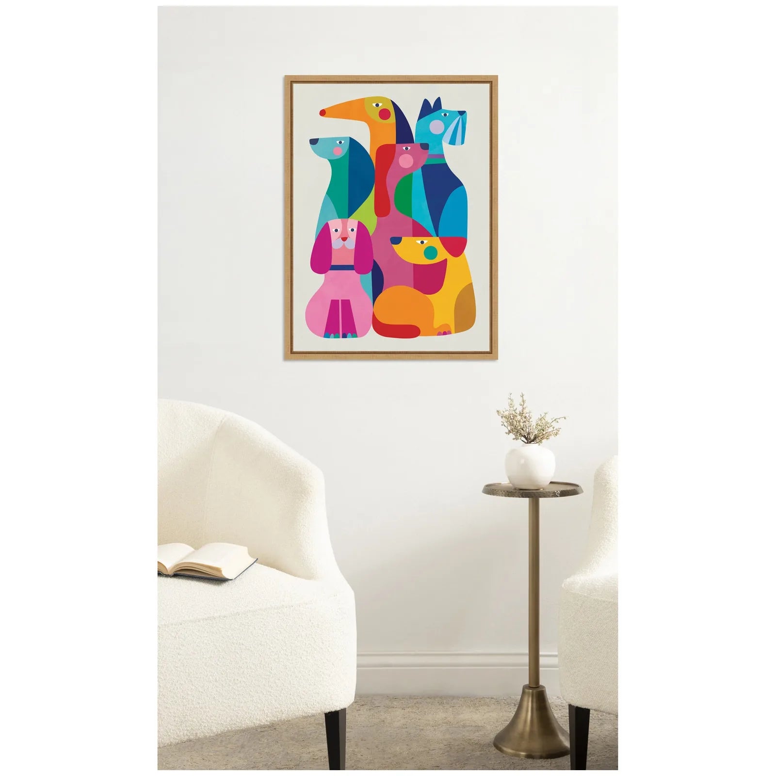 Colorful modern abstract dog artwork in a Sylvie frame, displayed on a wall above a cozy seating area.