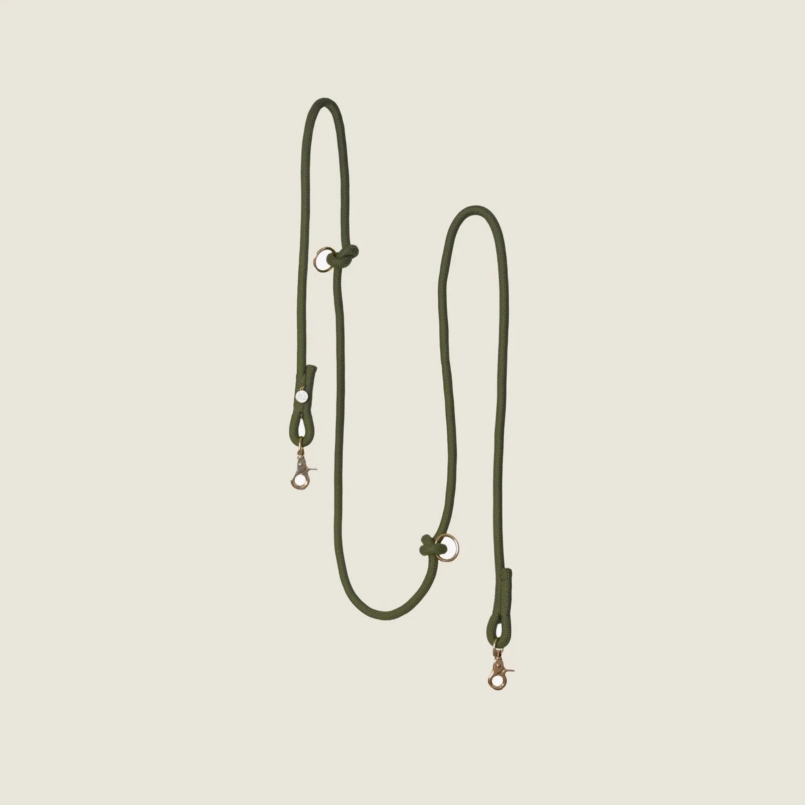 Moss green hands-free braided leash with gold hardware, designed for comfortable dog walking.