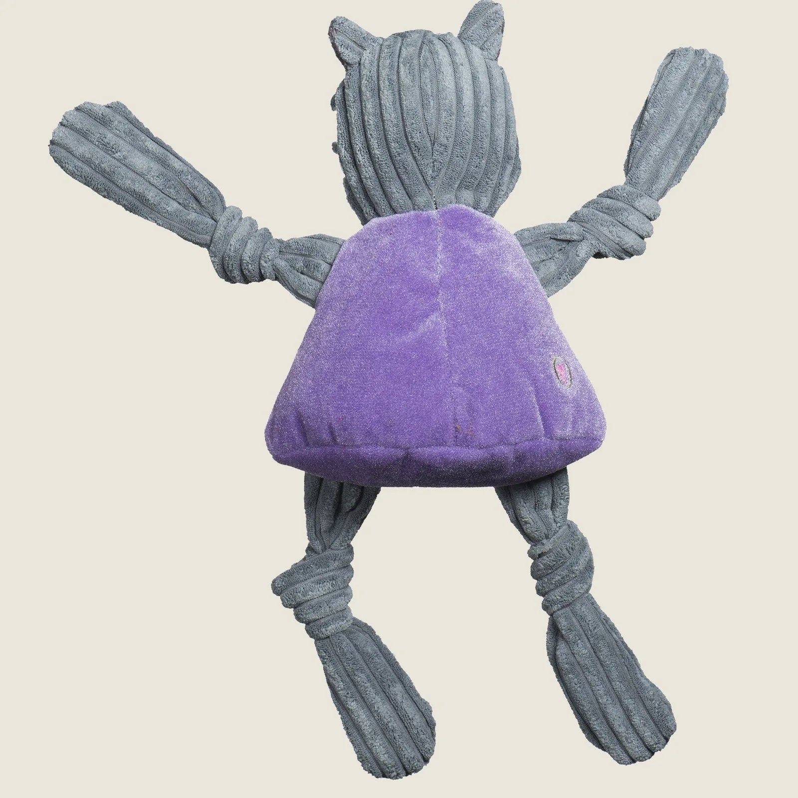 Plush Willie the Wildcat dog toy in gray with knotted limbs, featuring a purple body and soft, durable fabric for play.