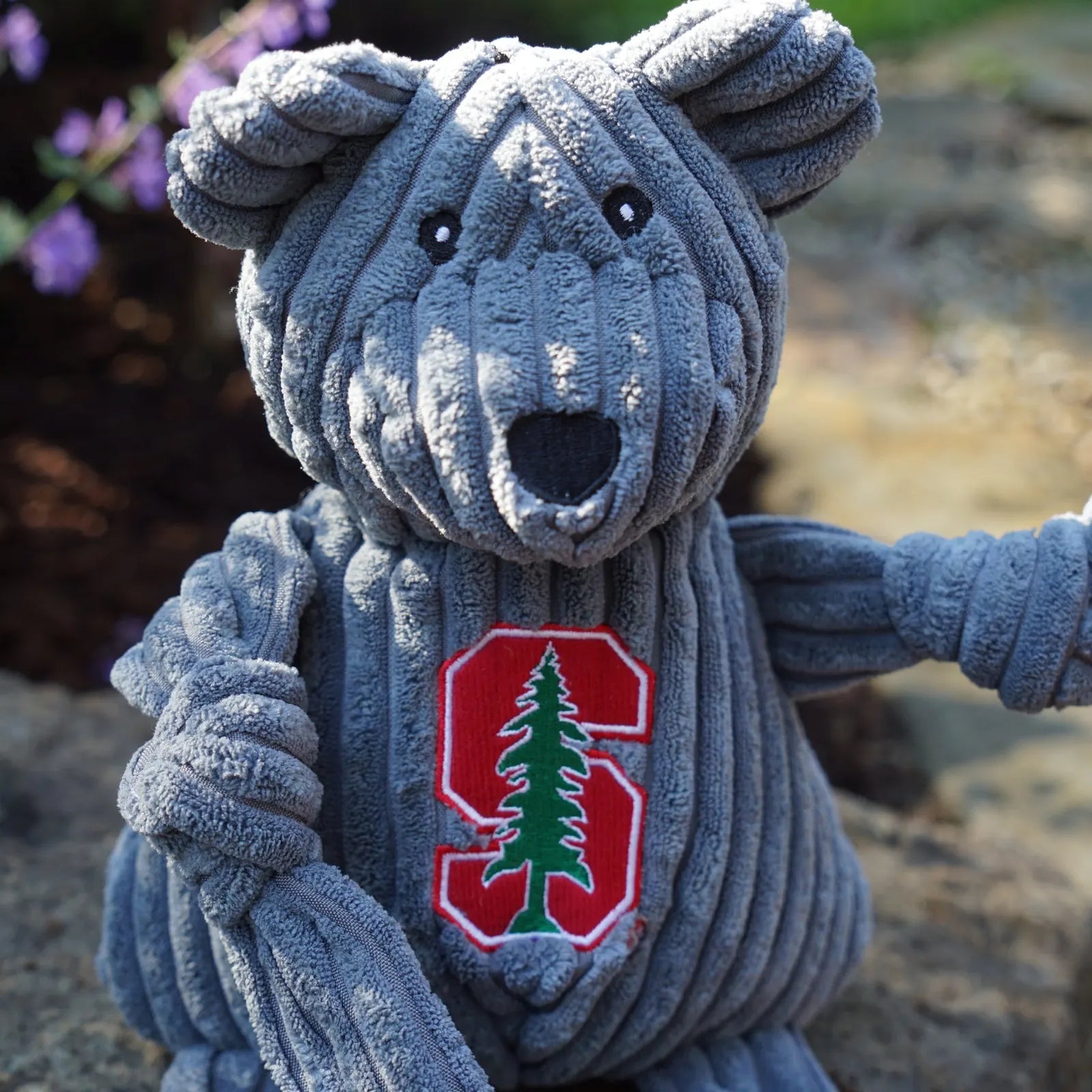Gray corduroy plush Stanford Tree Bear with knotted limbs, featuring the Stanford logo and five squeakers for playtime fun.