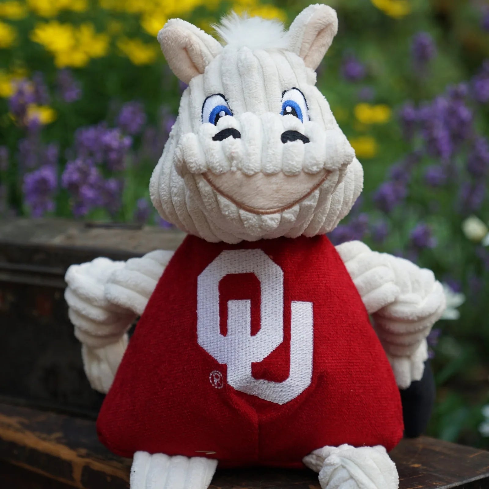 University of Oklahoma Sooner Knottie® plush dog toy with knotted limbs, smiling face, and red jersey featuring "OU."