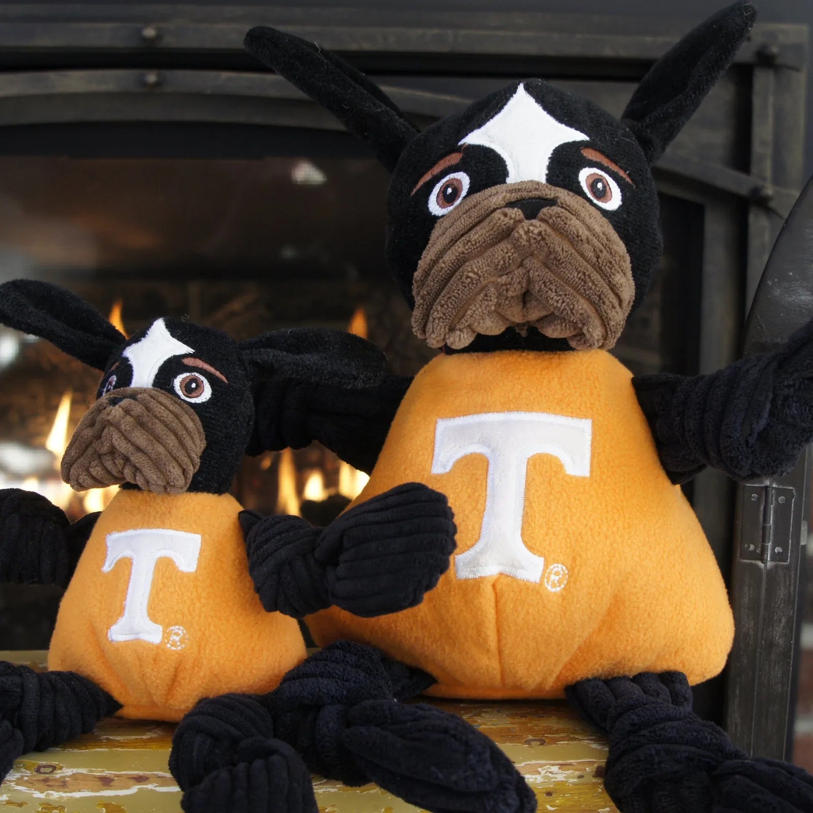 Smokey Knottie® plush dog toys in orange and black, featuring knotted limbs and University of Tennessee branding.