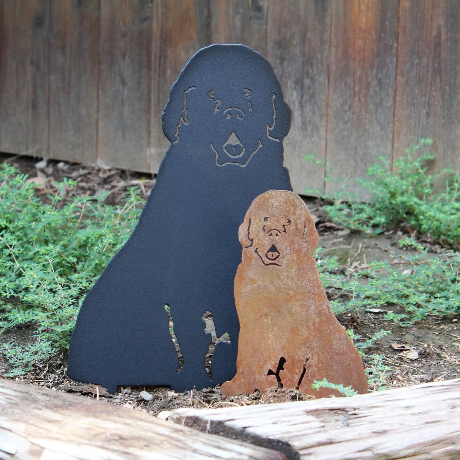 Newfoundland dog metal silhouette art in black and rust, designed for outdoor decor, displaying charming dog profiles.