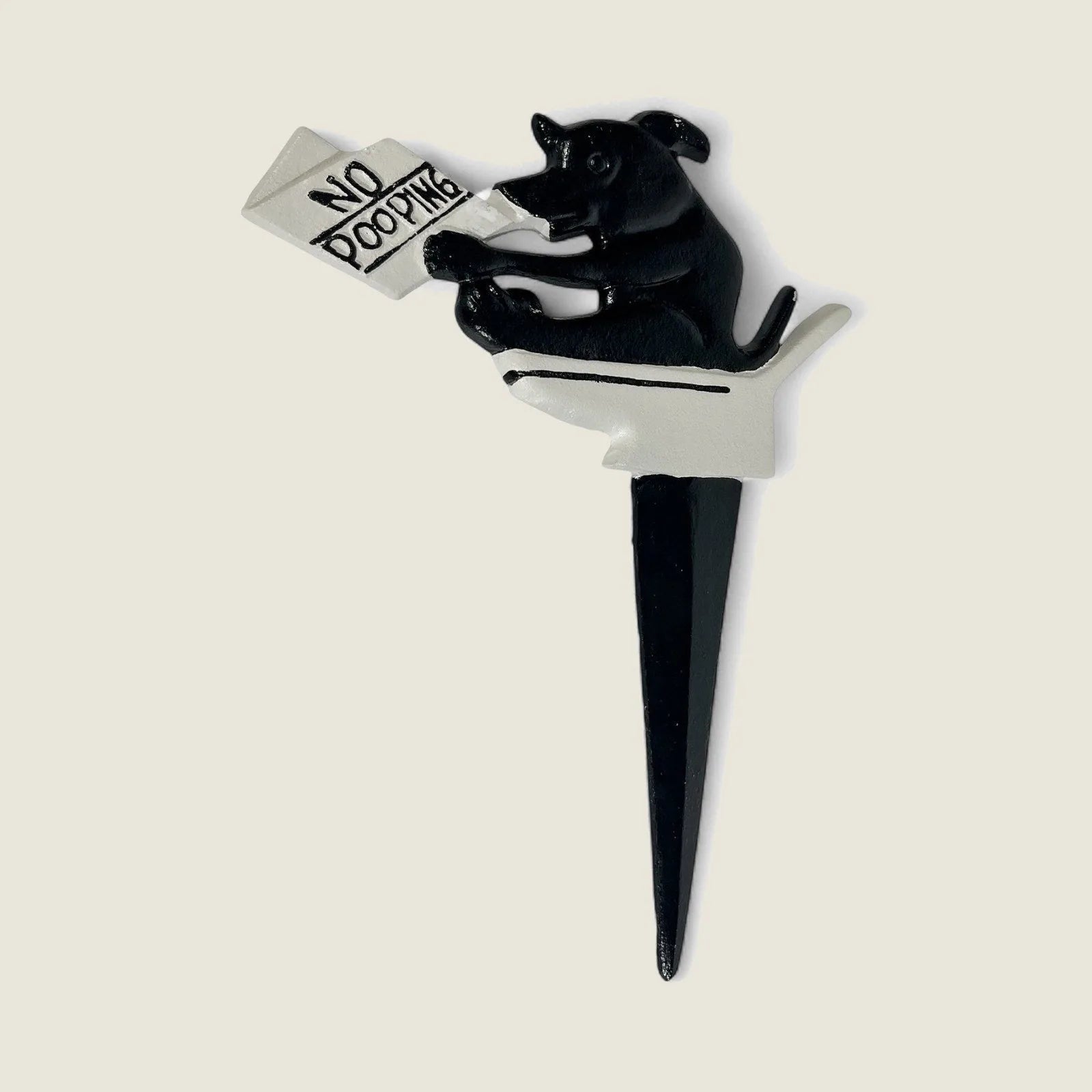 Cast iron dog yard sign with playful design, black and white colors, stating "No Pooping" for garden use.