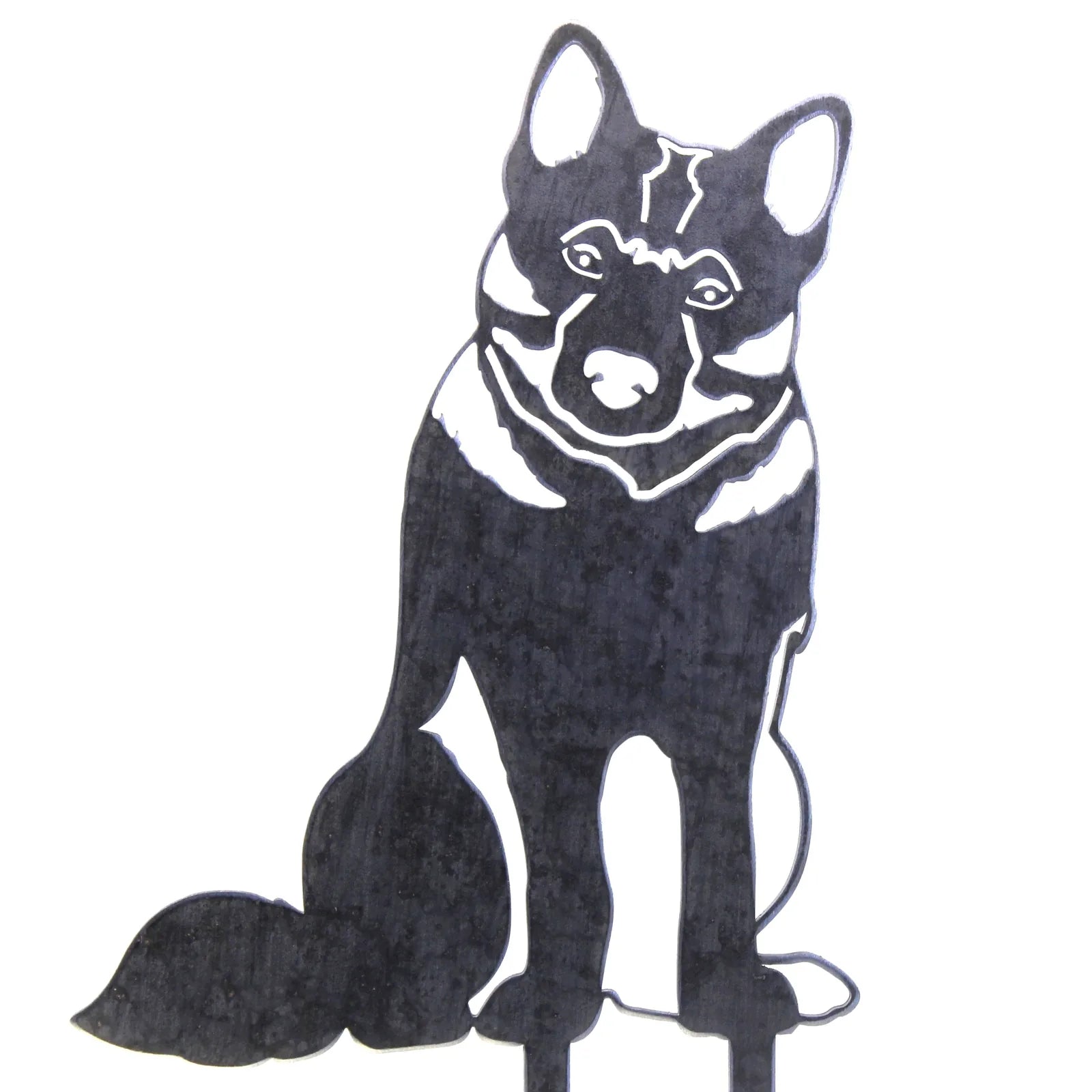 Handmade black metal silhouette of a Norwegian Elkhound, designed for outdoor décor, featuring detailed fur and posture.
