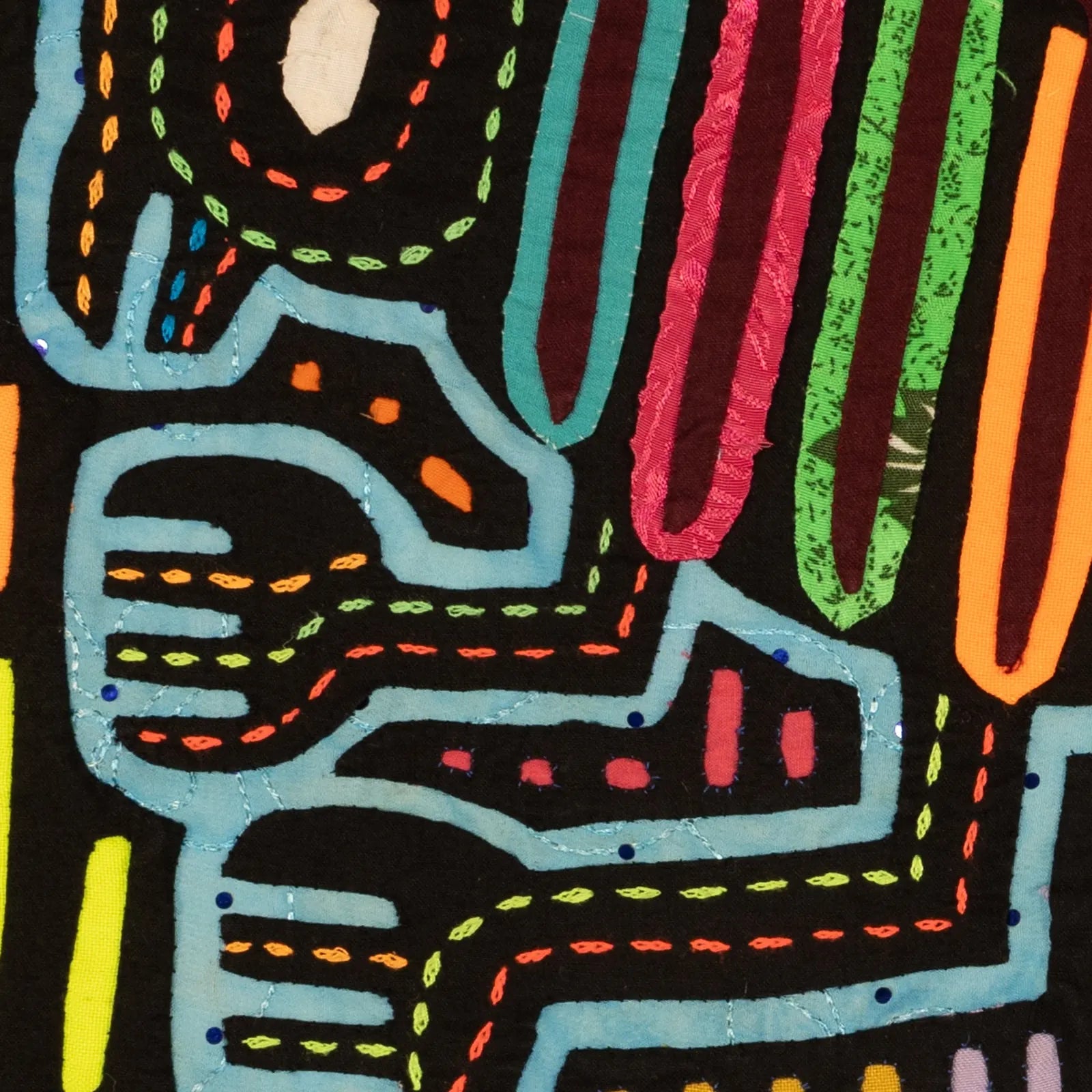 Colorful hand-stitched textile featuring abstract patterns in vibrant hues of pink, green, orange, and blue on a black bac...
