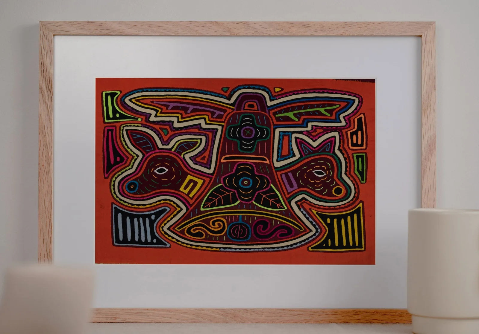 Hand-stitched orange and white puppy design in vivid colors, showcased in a decorative frame for home décor.