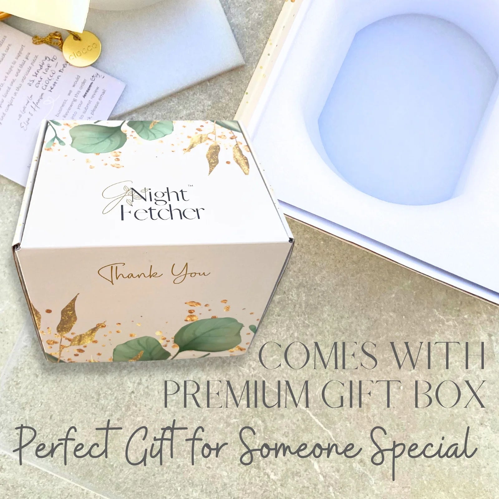 White gift box with gold accents and floral design, labeled "Thank You," showcasing premium packaging for GNight Fetcher.