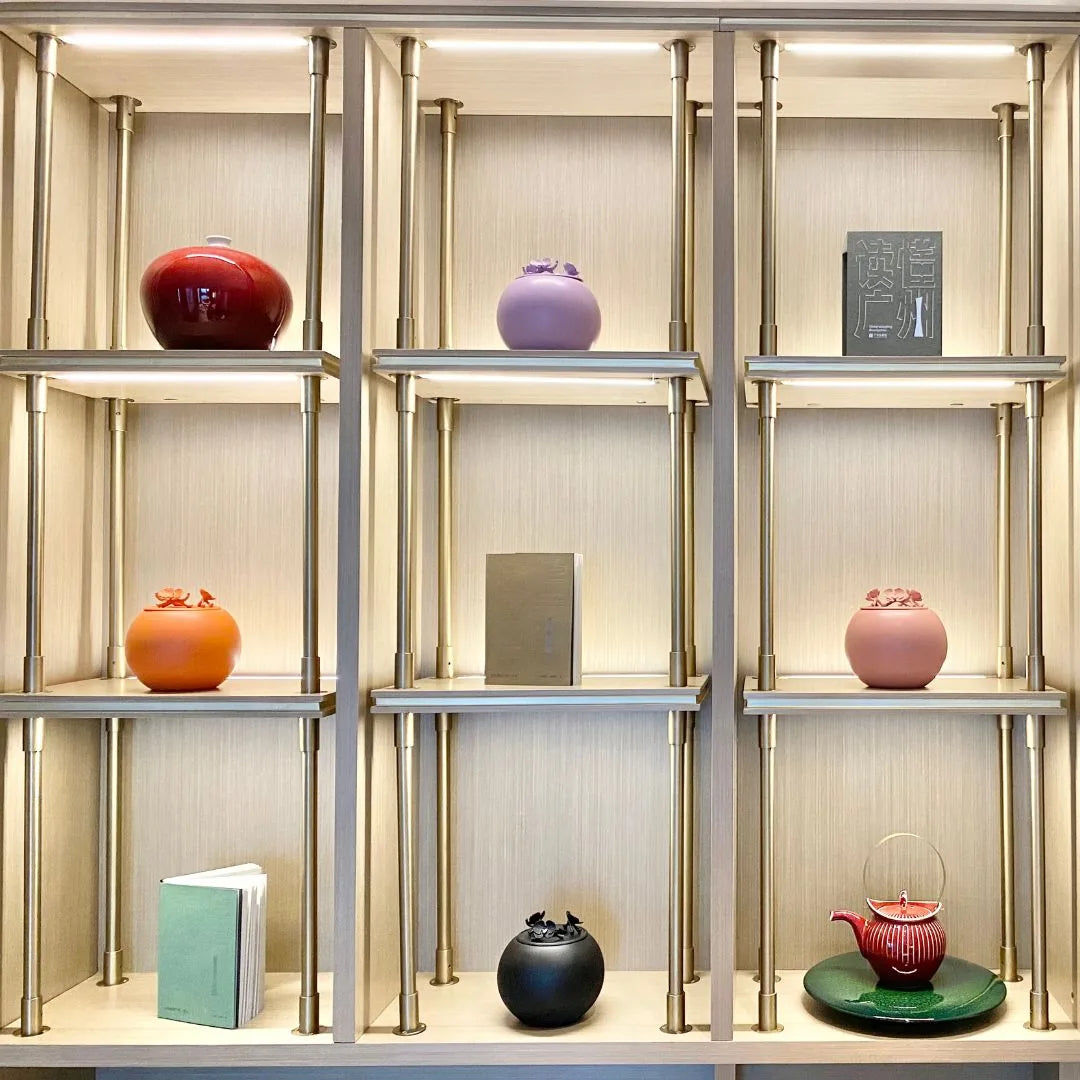 Lavender orchid urn displayed among various decorative objects, highlighting its calm, elegant design for pet memorials.