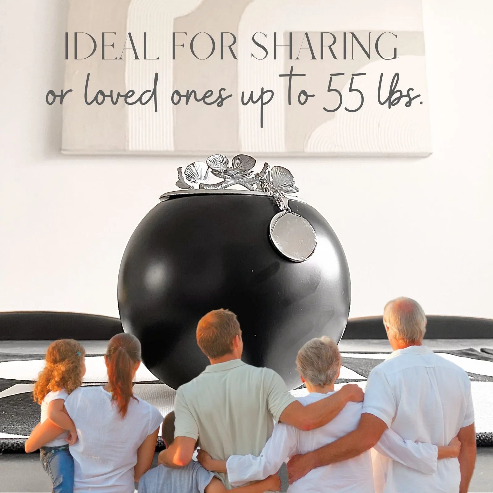 Handmade black Orchid Urn with silver floral accents, ideal for honoring pets up to 55 lbs. Family gathering in background.