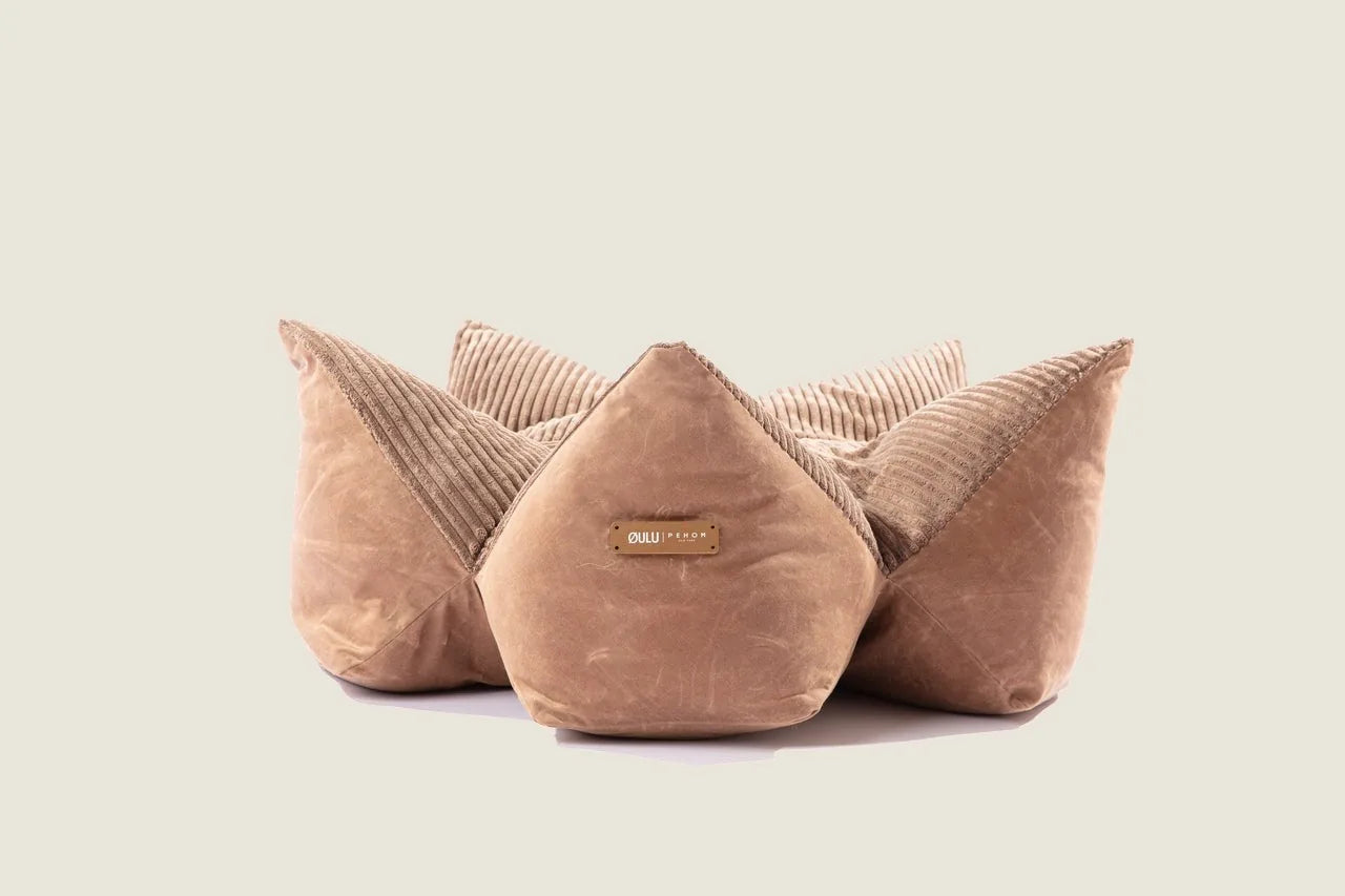 Round plush pet bed in Canyon Brown with cozy corduroy fabric and raised edges, designed to support your pet comfortably.