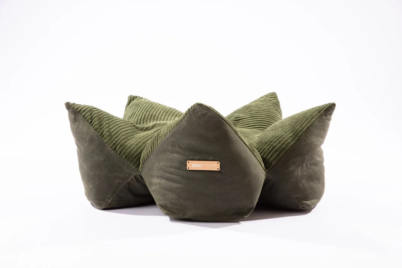 Round olive green pet pillow bed with raised edges and soft corduroy texture, designed to support your pet's comfort.