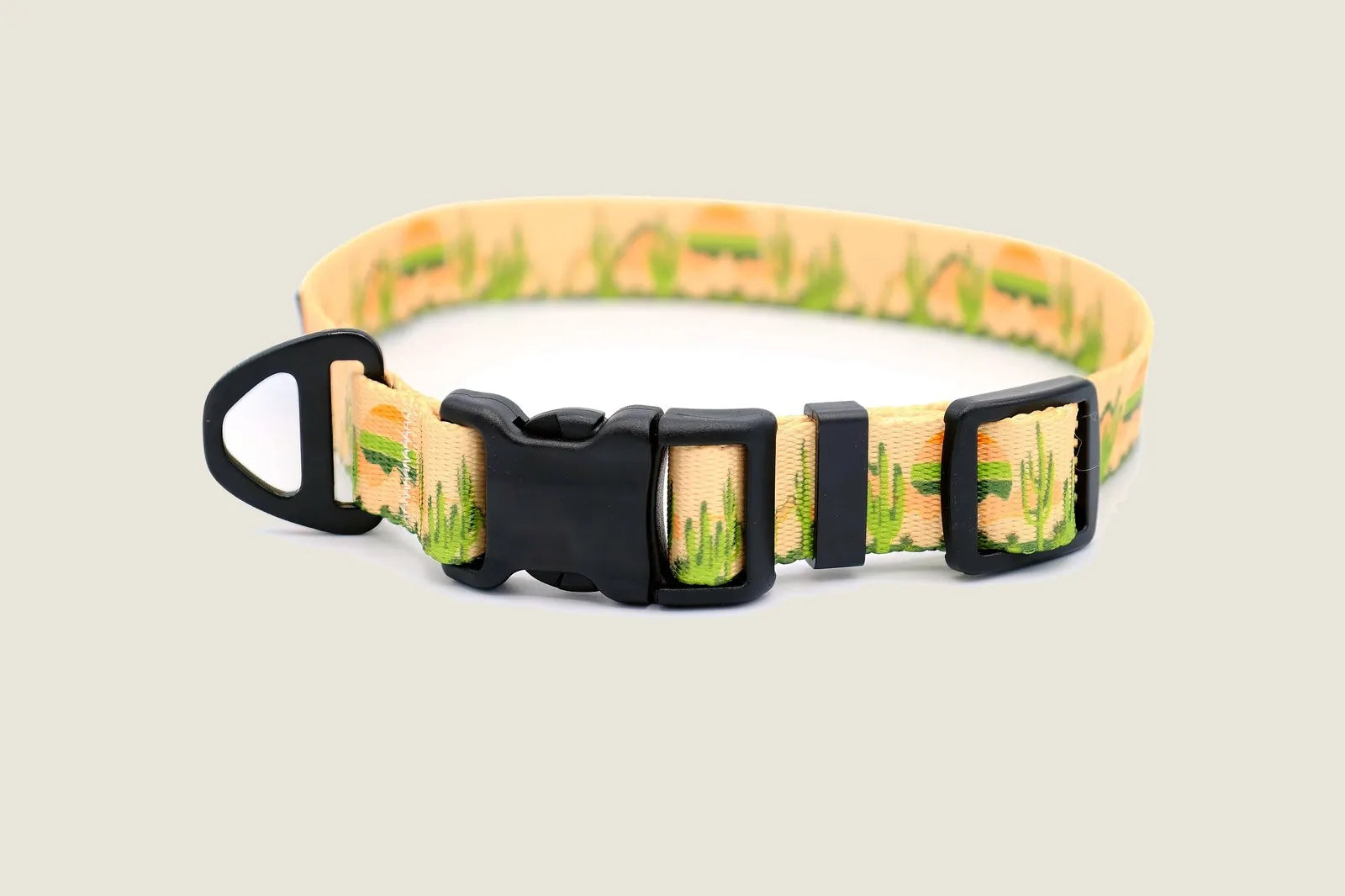 Cactus cream nylon dog collar featuring a durable YKK buckle and vibrant green cactus pattern for outdoor adventures.