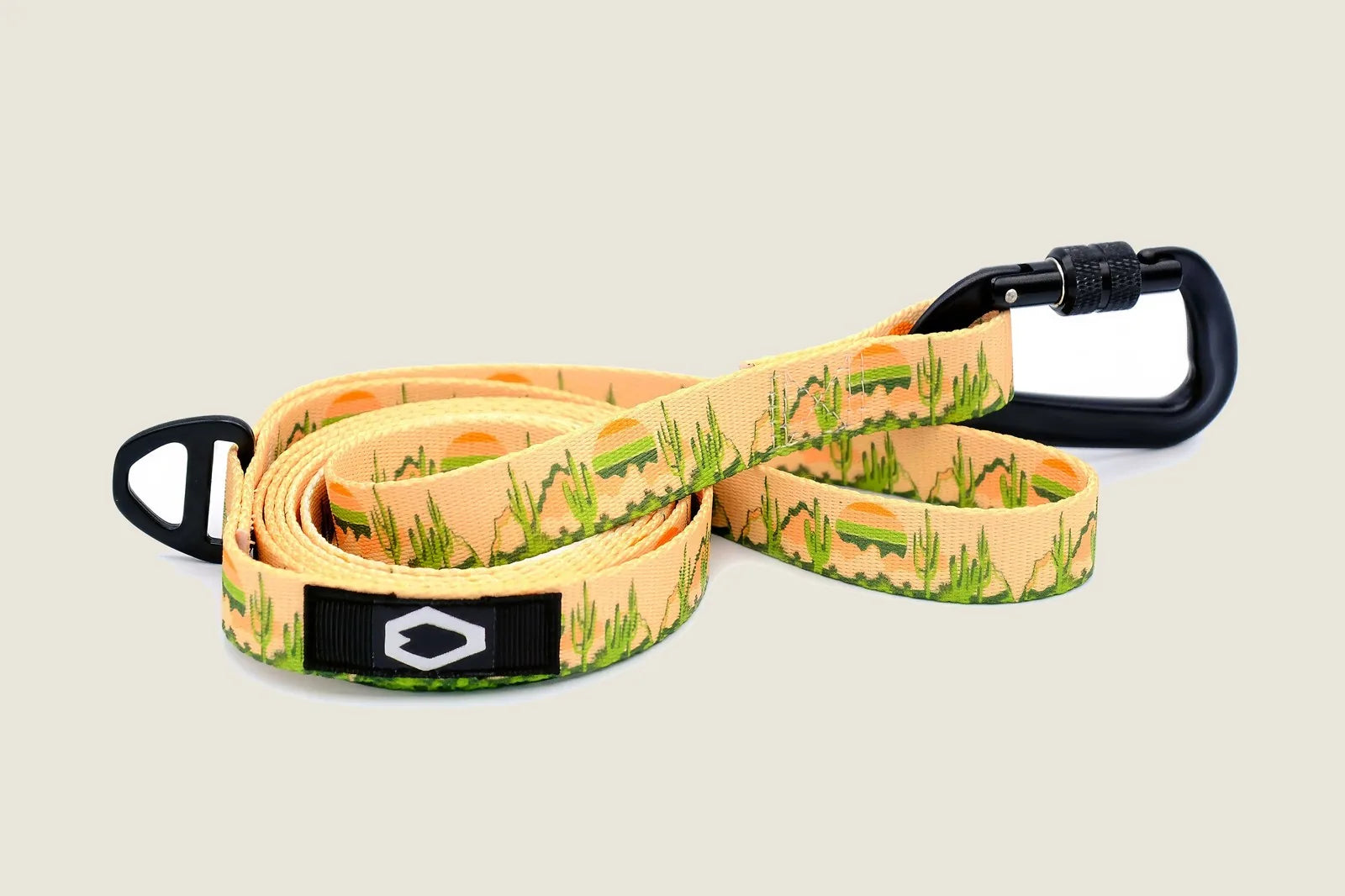 Cactus cream nylon dog leash with vibrant desert pattern, featuring a black aluminum carabiner and D-ring for practicality.