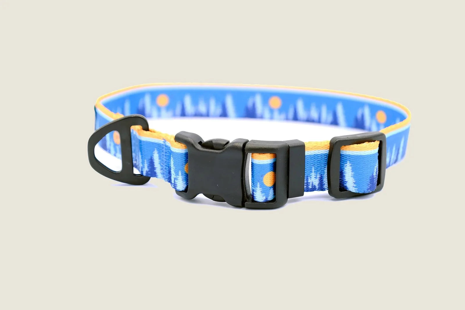 Bright blue nylon dog collar featuring a forest design, strong black buckle, and adjustable sizing for active dogs.
