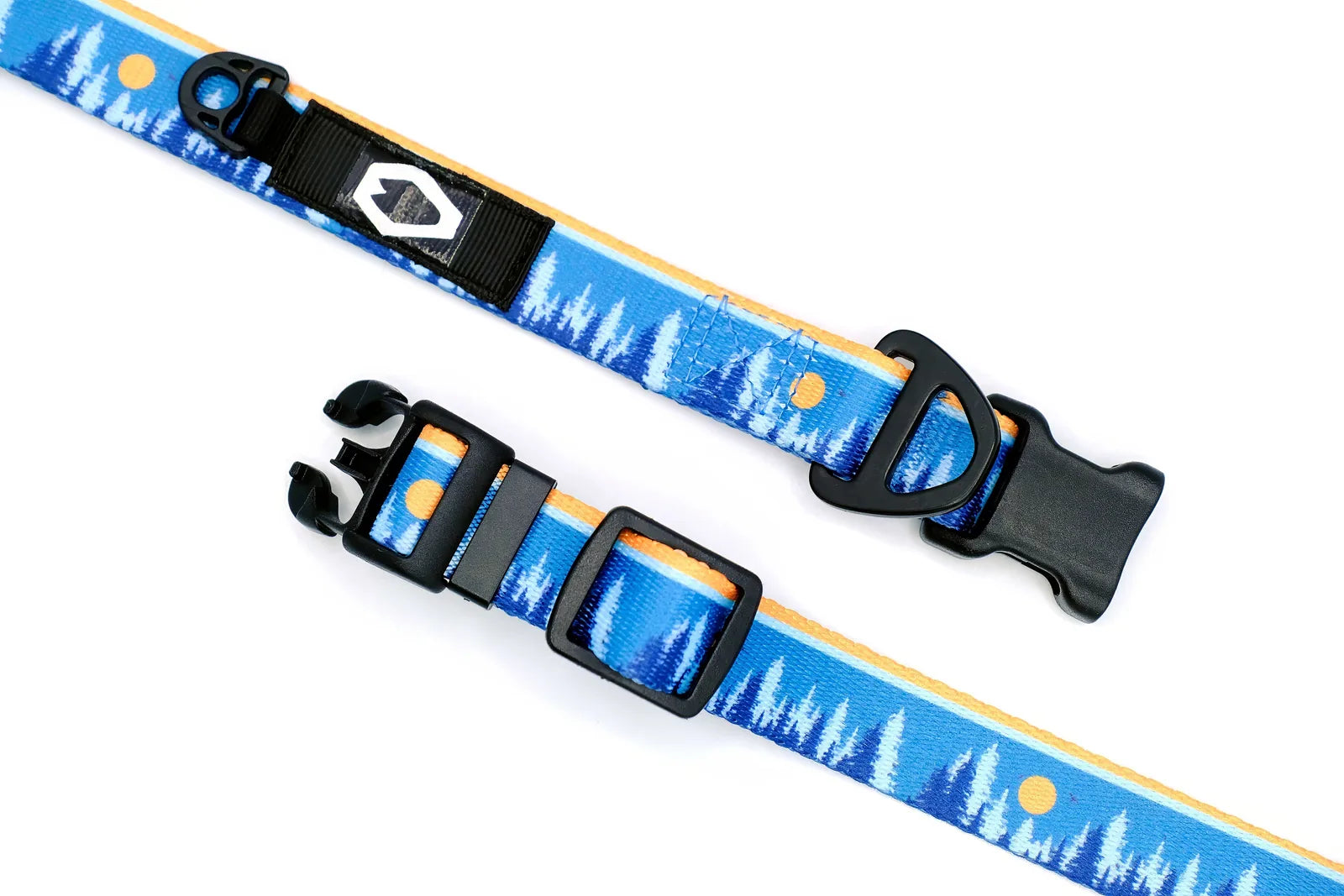 Nylon dog collar featuring a blue frozen forest pattern with a sun, equipped with a strong YKK buckle and adjustable fit.