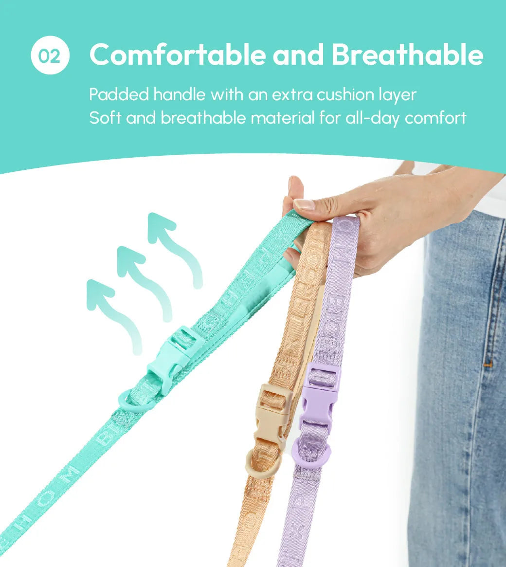 Padded mint green dog leash with reinforced stitching and durable webbing, held alongside apricot and mint purple options.