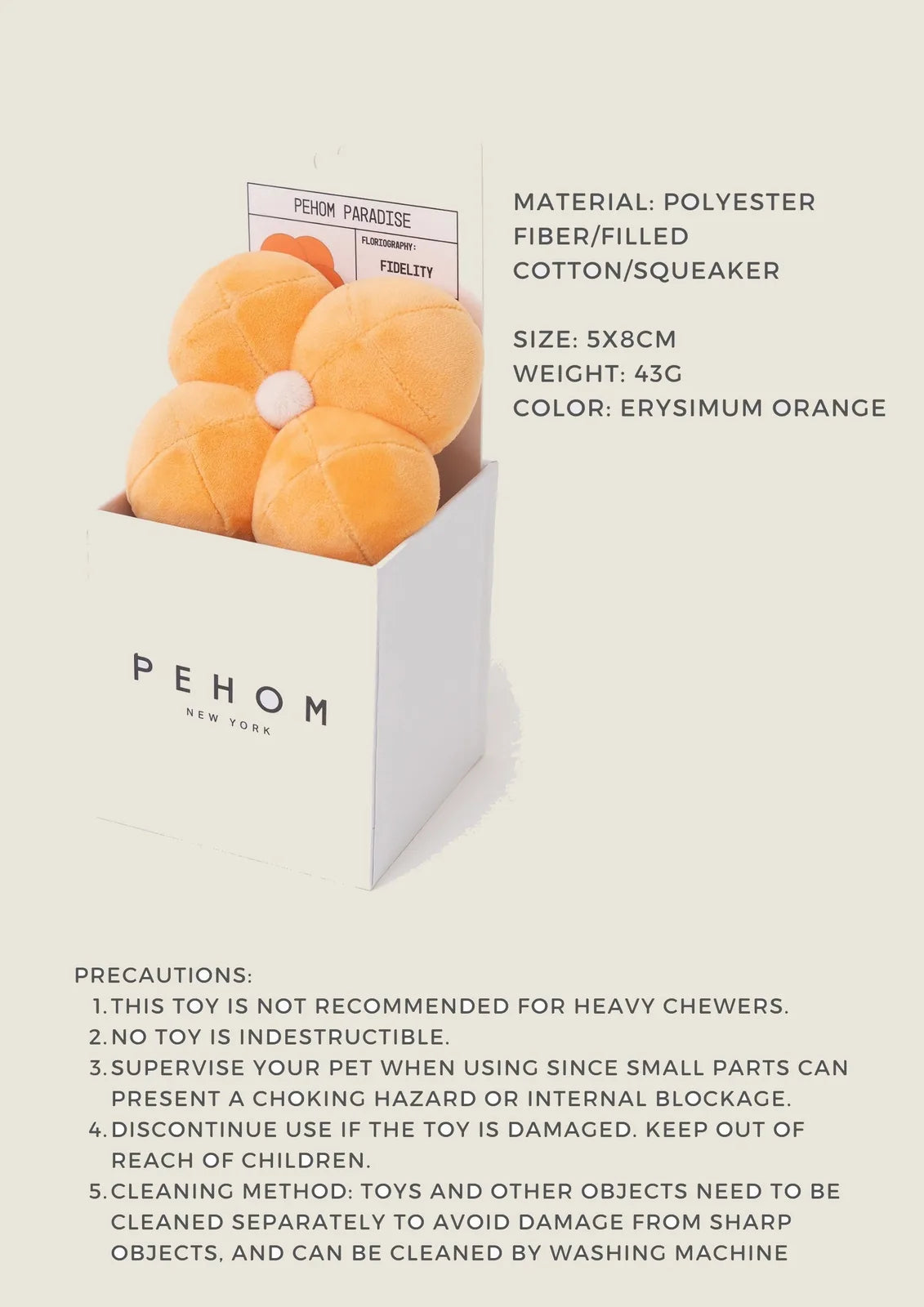 Plush orange flower-shaped dog toy with squeaker, nestled in a PEHOM box. Ideal for playful engagement.