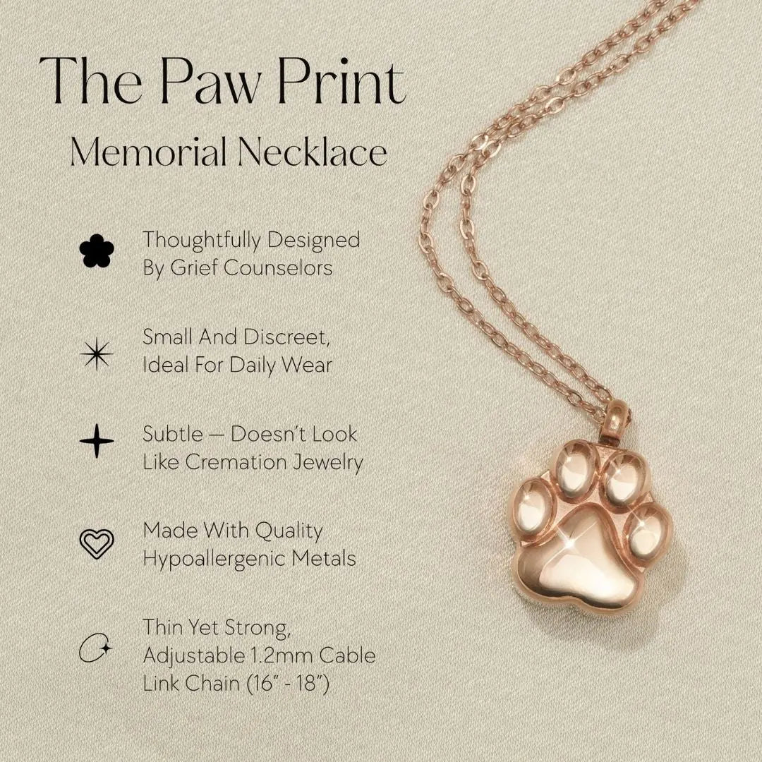 Rose gold paw print cremation necklace for pet ashes, featuring an adjustable chain and subtle, elegant design.