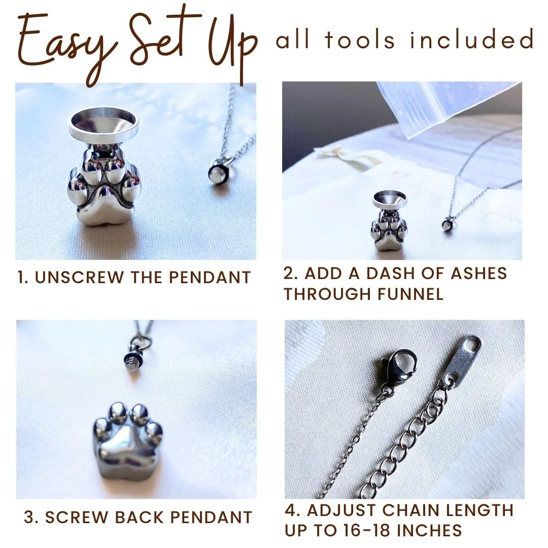 Paw print cremation necklace setup with funnel, pendant, and adjustable chain displayed on soft fabric.