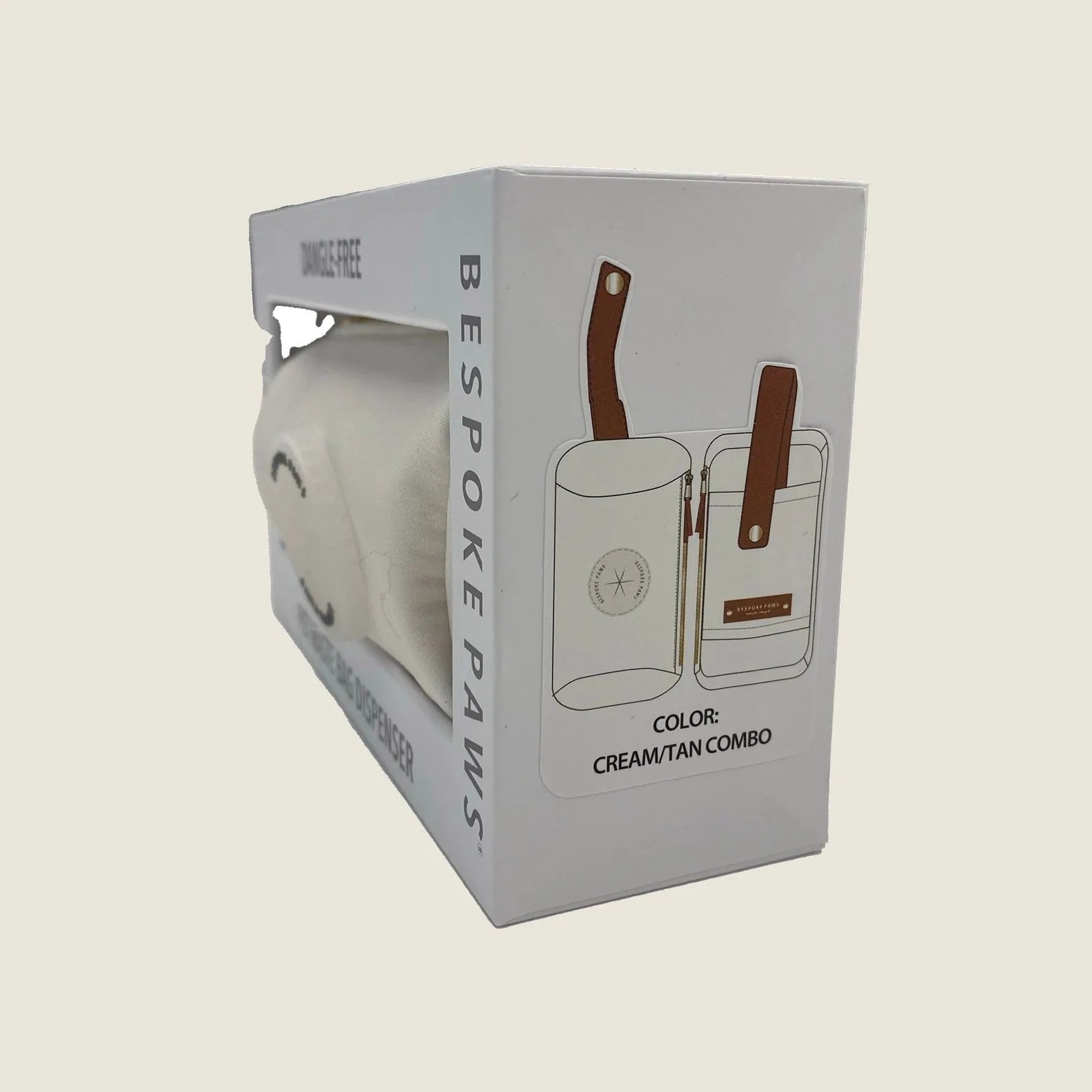 Dangle-free waste bag dispenser in cream with tan accents, showcasing sleek design and premium vegan leather.