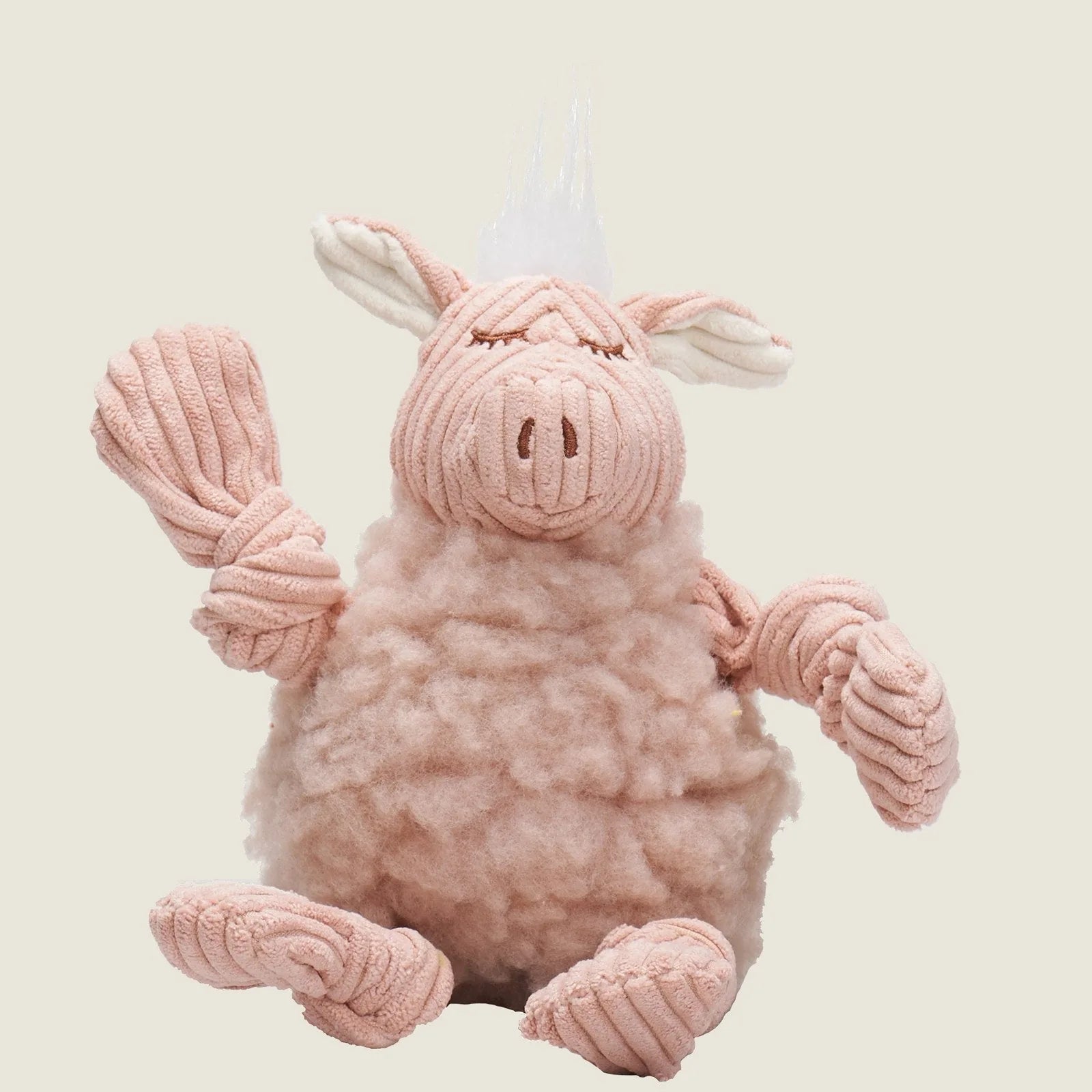 Soft pink plush pig dog toy with a fluffy body, rope limbs, and squeaker features, perfect for cuddling and play.