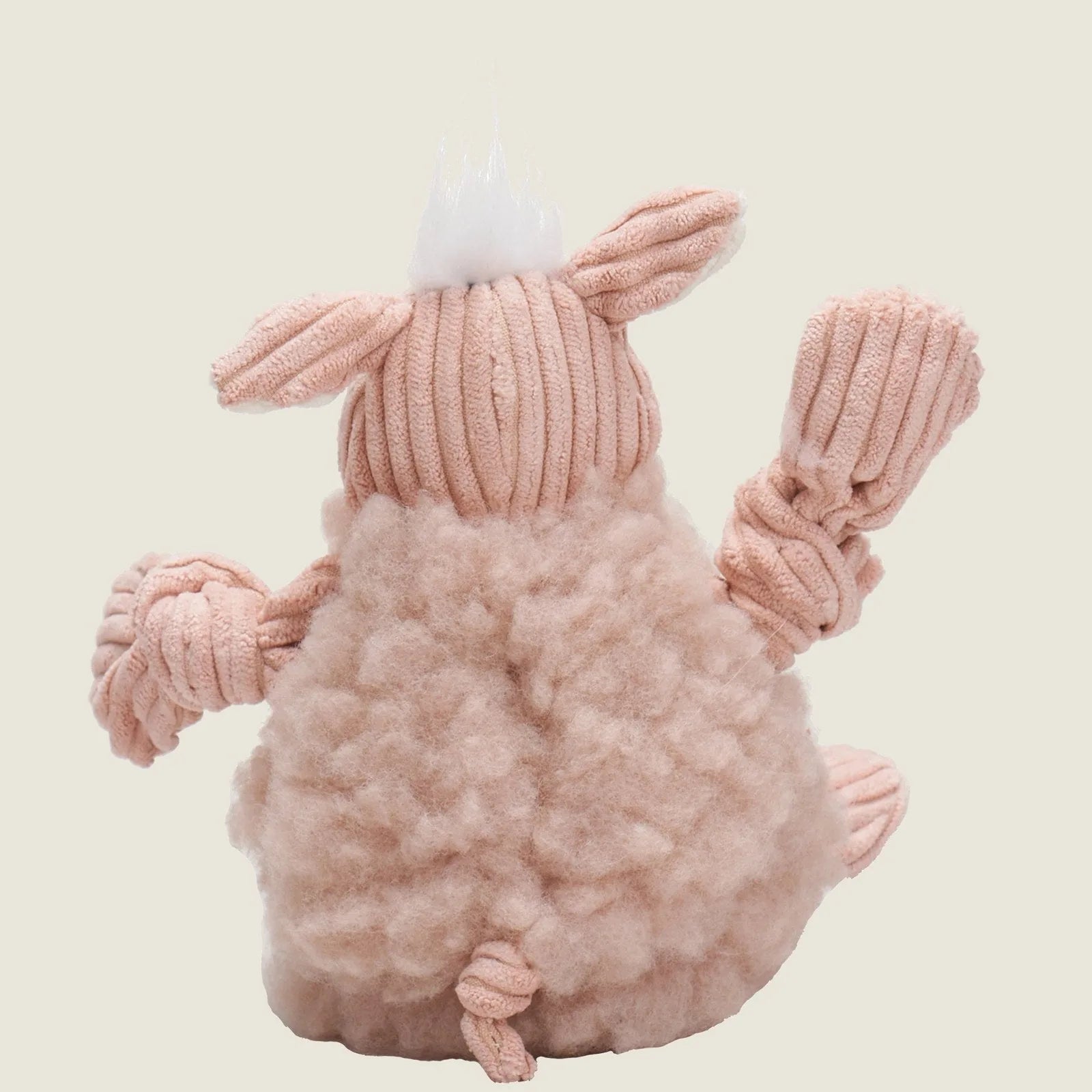 Penelope Pig plush dog toy in soft pink fleece, featuring knotted limbs and a fluffy textured body for cuddling and play.