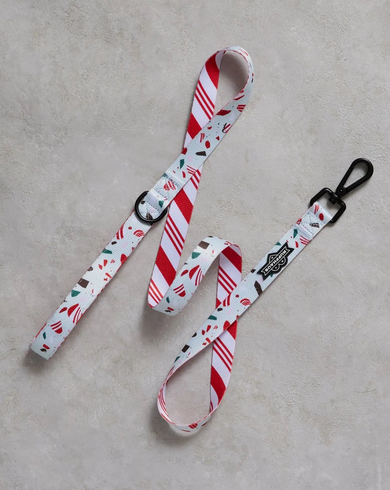 Peppermint Bark dog leash with a festive red and white striped pattern, featuring treats and decorated elements on durable...
