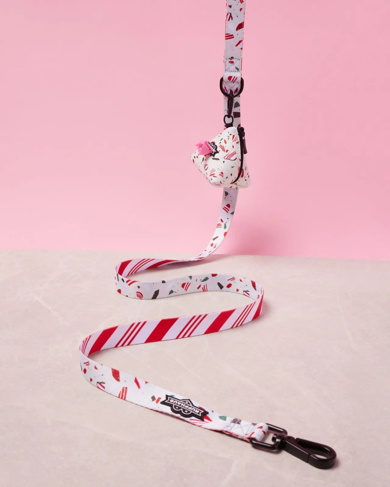 Peppermint bark patterned dog leash with a neoprene handle, featuring a swivel snap clasp and D-ring for accessories.