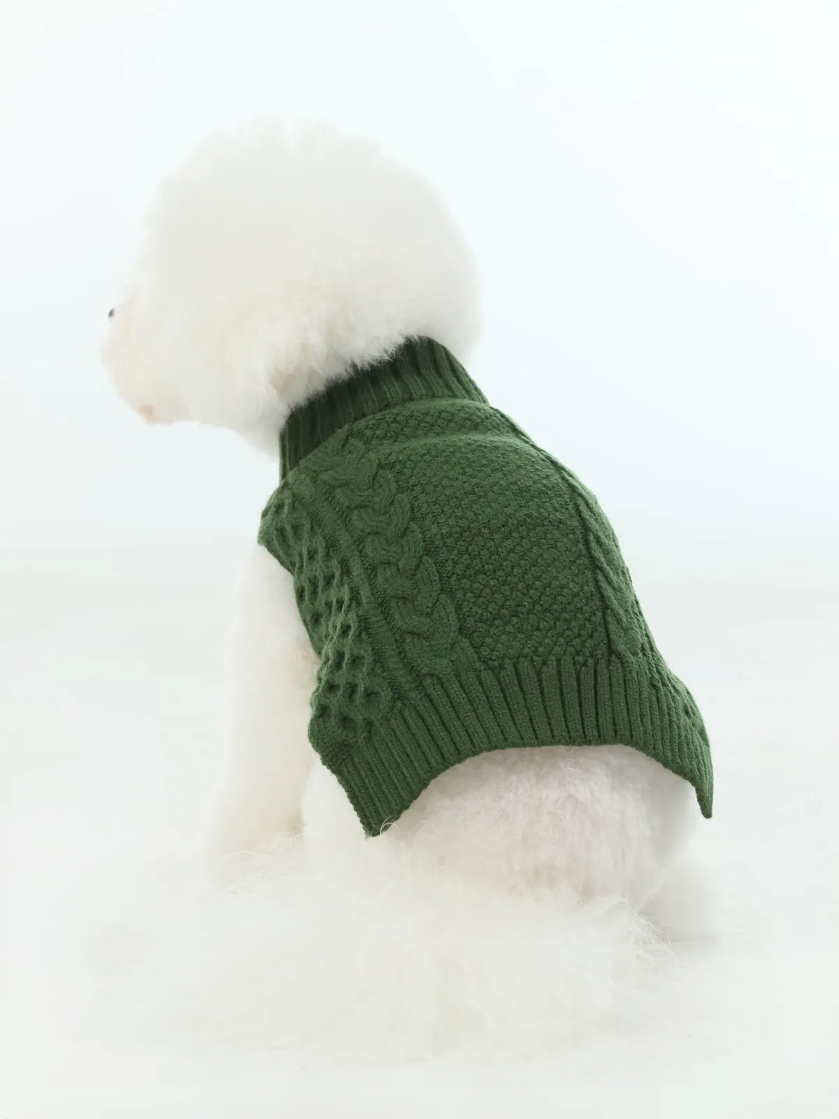 Cozy green knit dog sweater vest with a high collar, perfect for cooler days, seen from the side on a fluffy dog.