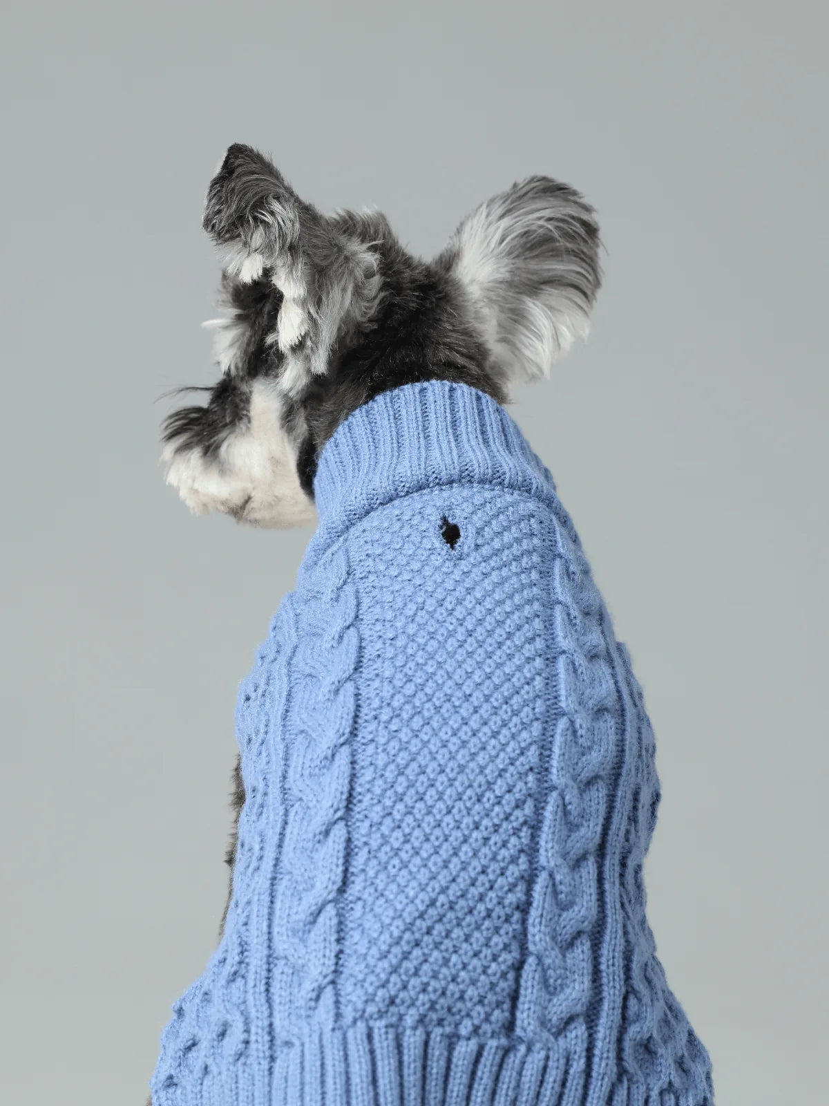 Cozy ice blue knit sweater vest for dogs with textured patterns and stretchable openings for easy wear.