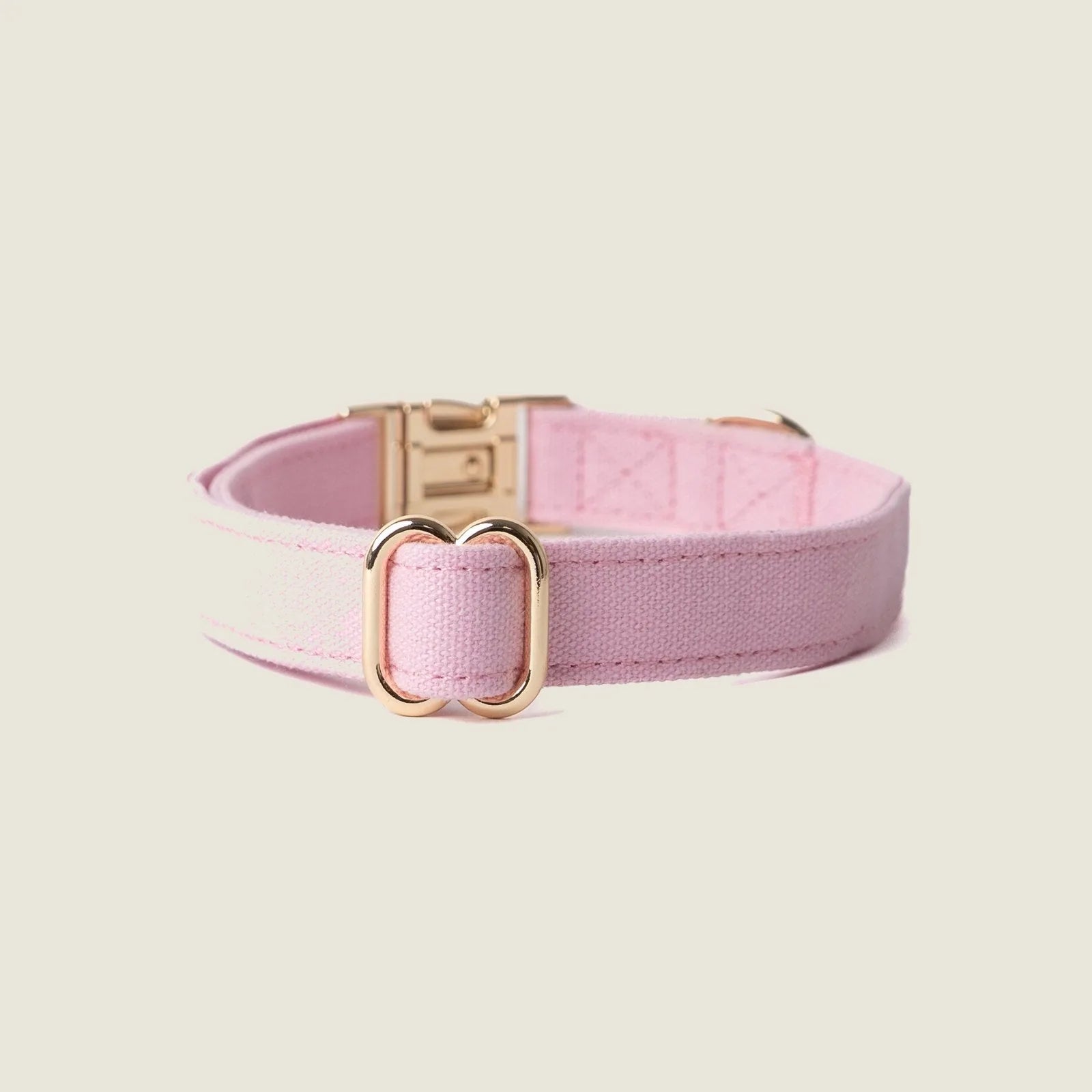 Light pink canvas dog collar by FURLOU with gold hardware and a sleek design, perfect for stylish daily wear.