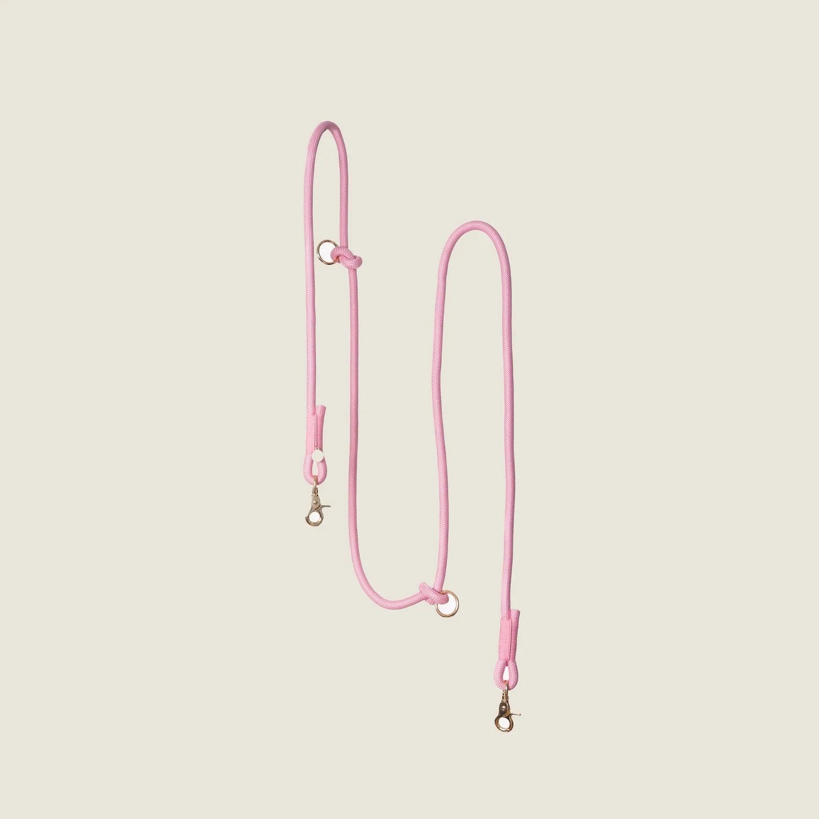 Pink hands-free braided leash by FURLOU, featuring sturdy clasps and a flexible design for convenient dog walking.
