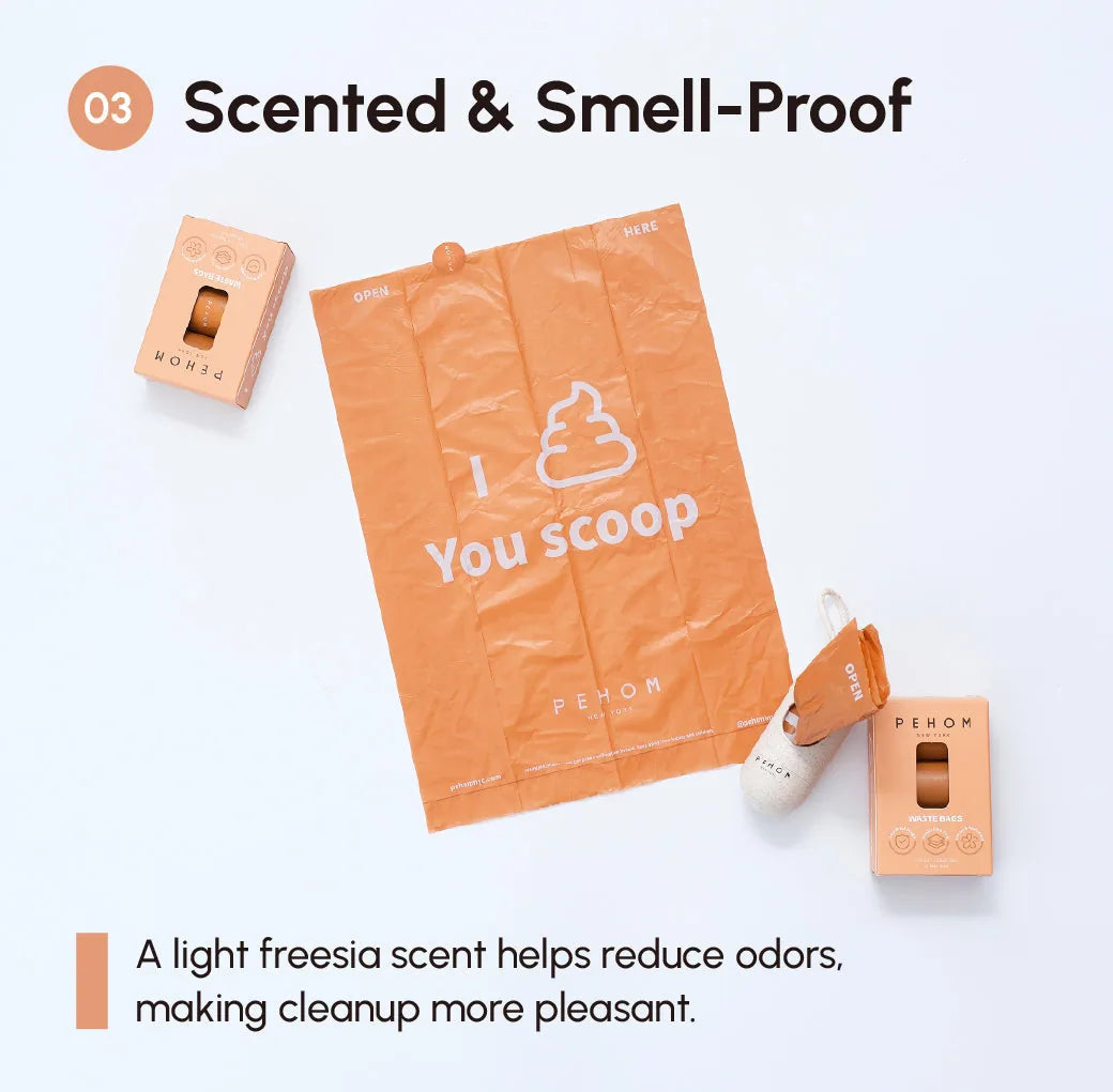 Orange poop bag with "I You scoop" text, pehomnyc dispenser, featuring a light freesia scent for odor reduction.