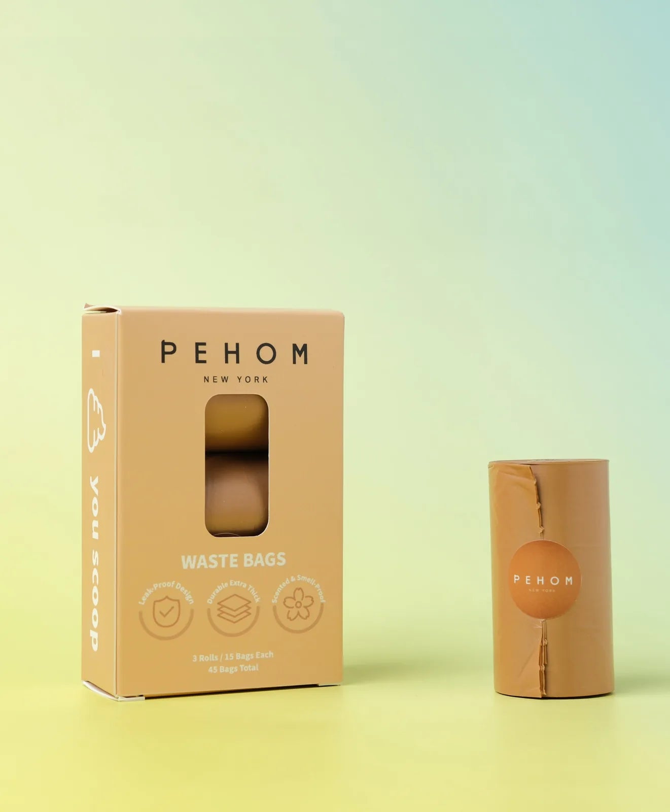 Peholding biodegradable poop bags in a sleek, orange packaging with a light green background, ideal for pet owners.