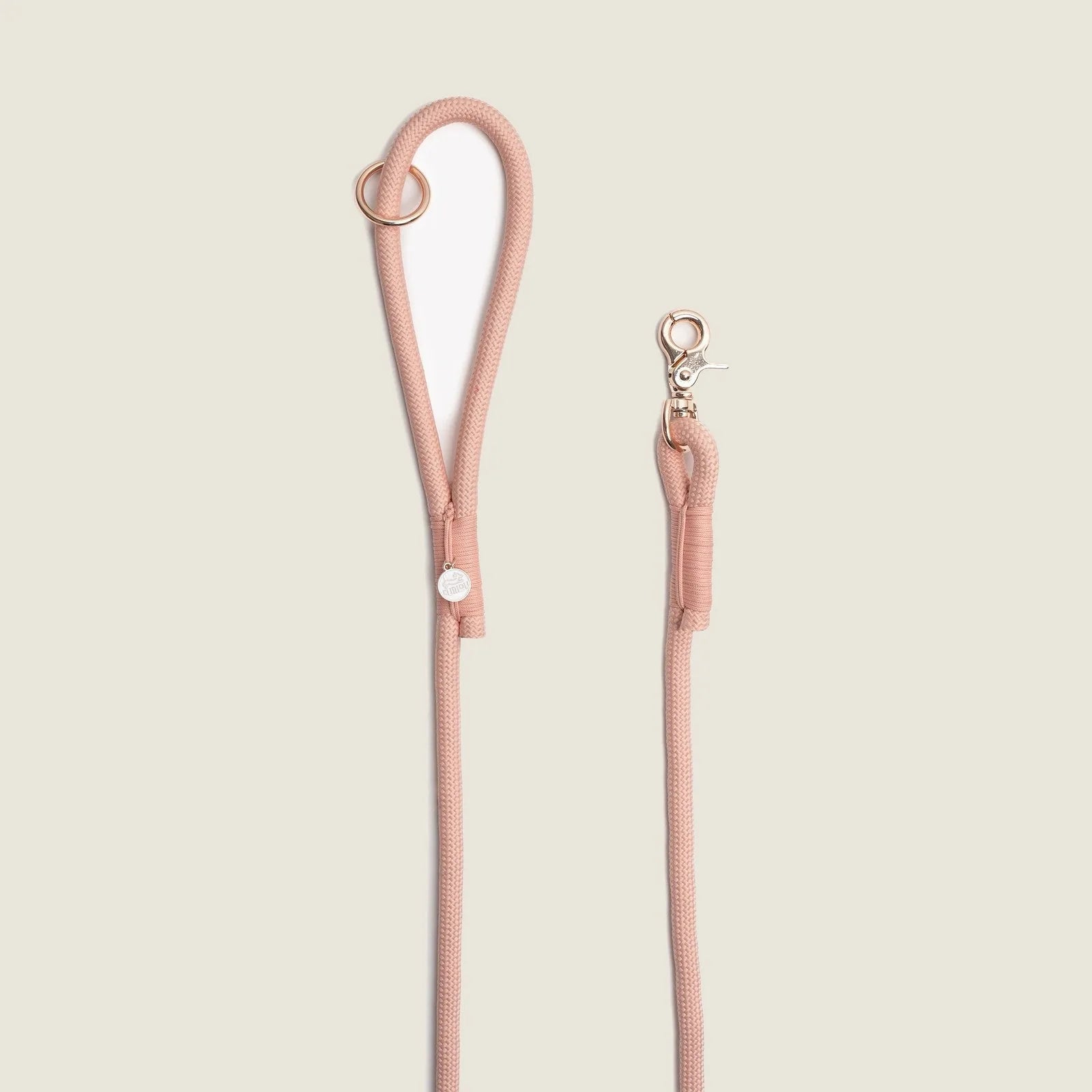 Powder rose braided rope leash by FURLOU with an O-ring handle and sturdy clip for easy dog walking.