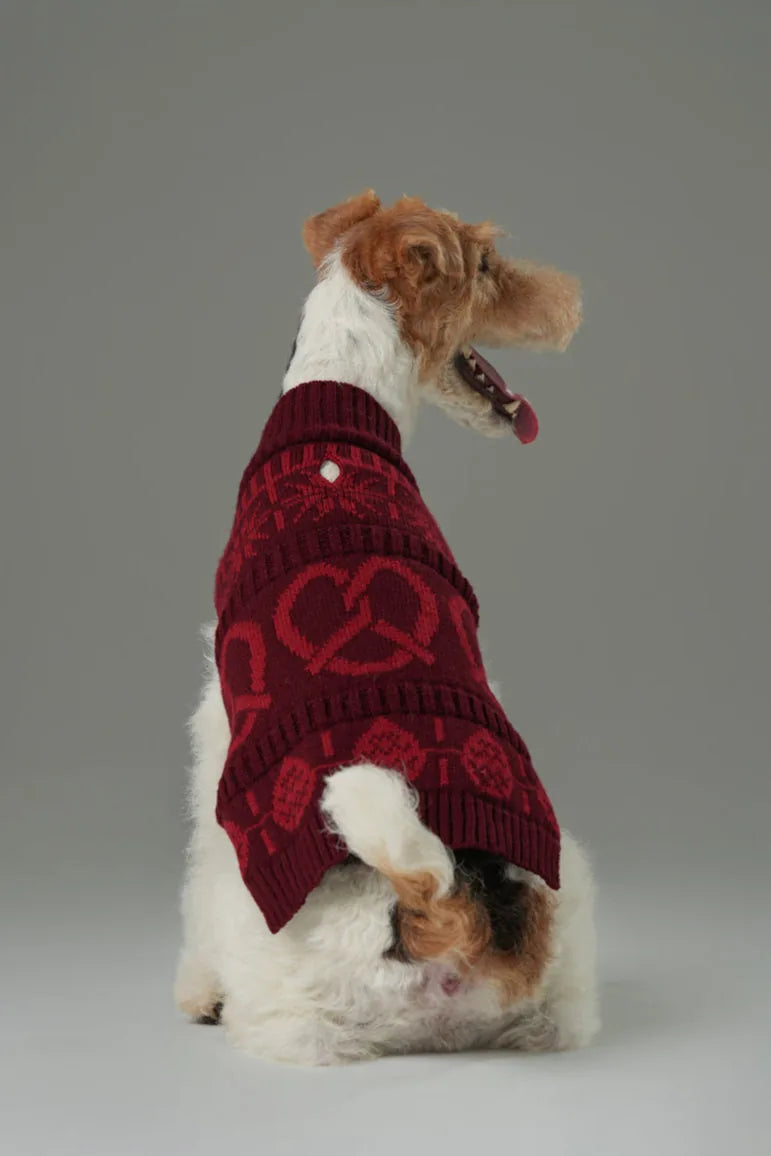 Burgundy red knit dog sweater featuring a cozy design with heart and pretzel patterns, perfect for cooler seasons.