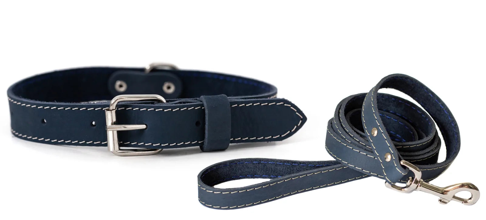 Soft navy leather collar and leash set featuring white stitching and a silver buckle, ideal for stylish dog walking.