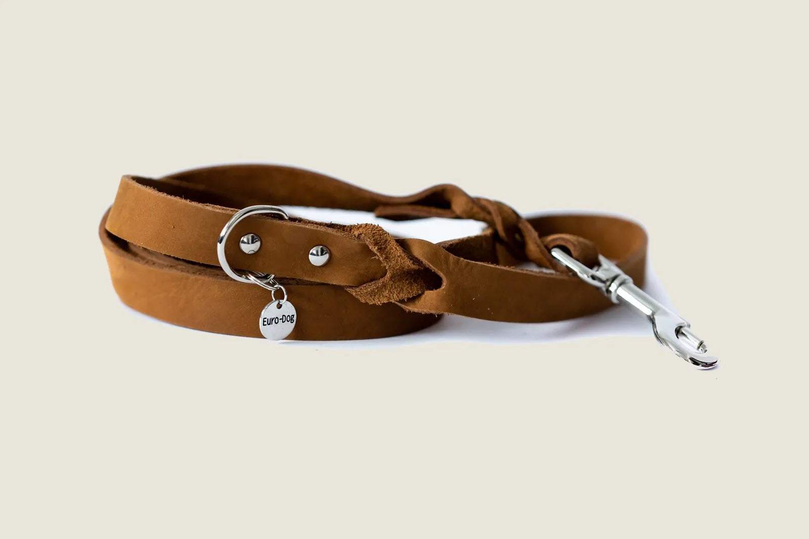 Braided tan leather dog leash by Euro-Dog with silver hardware, ideal for stylish daily walks.