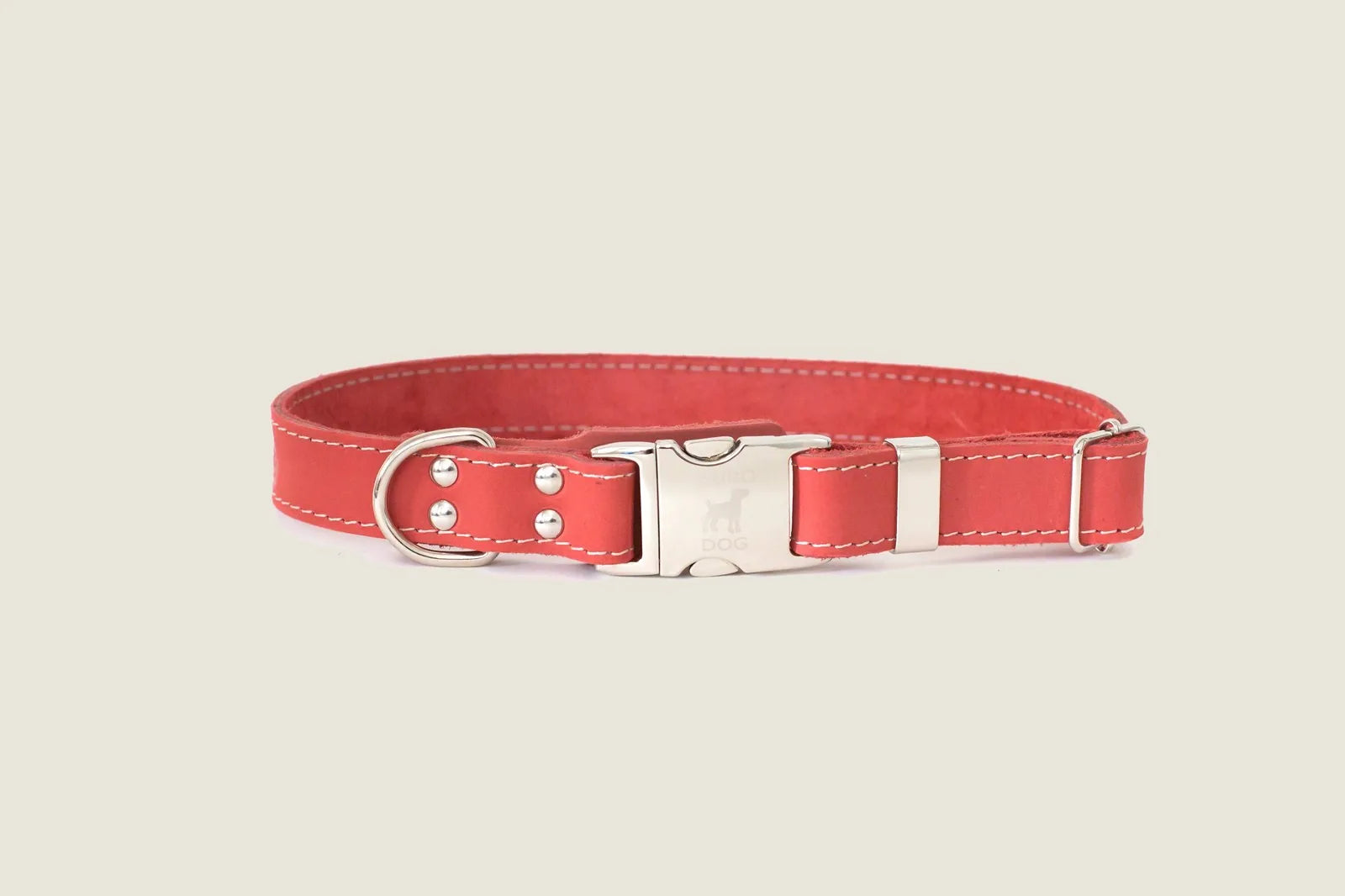Quick-release coral reef leather dog collar featuring a metal buckle and steel D-ring for leash attachment.