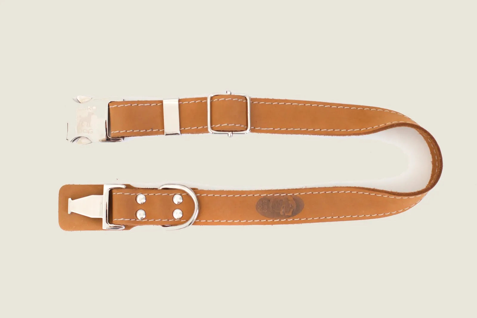 Khaki leather dog collar with metal buckle, featuring a steel D-ring and reinforced stitching for durability.