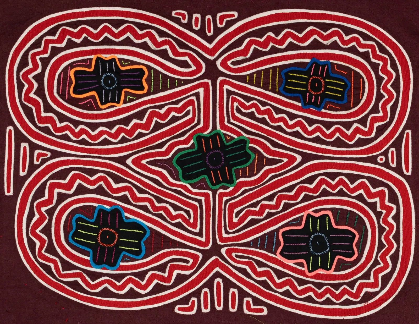 Hand-stitched Panama Mola tapestry featuring vibrant geometric patterns on a rich maroon background.